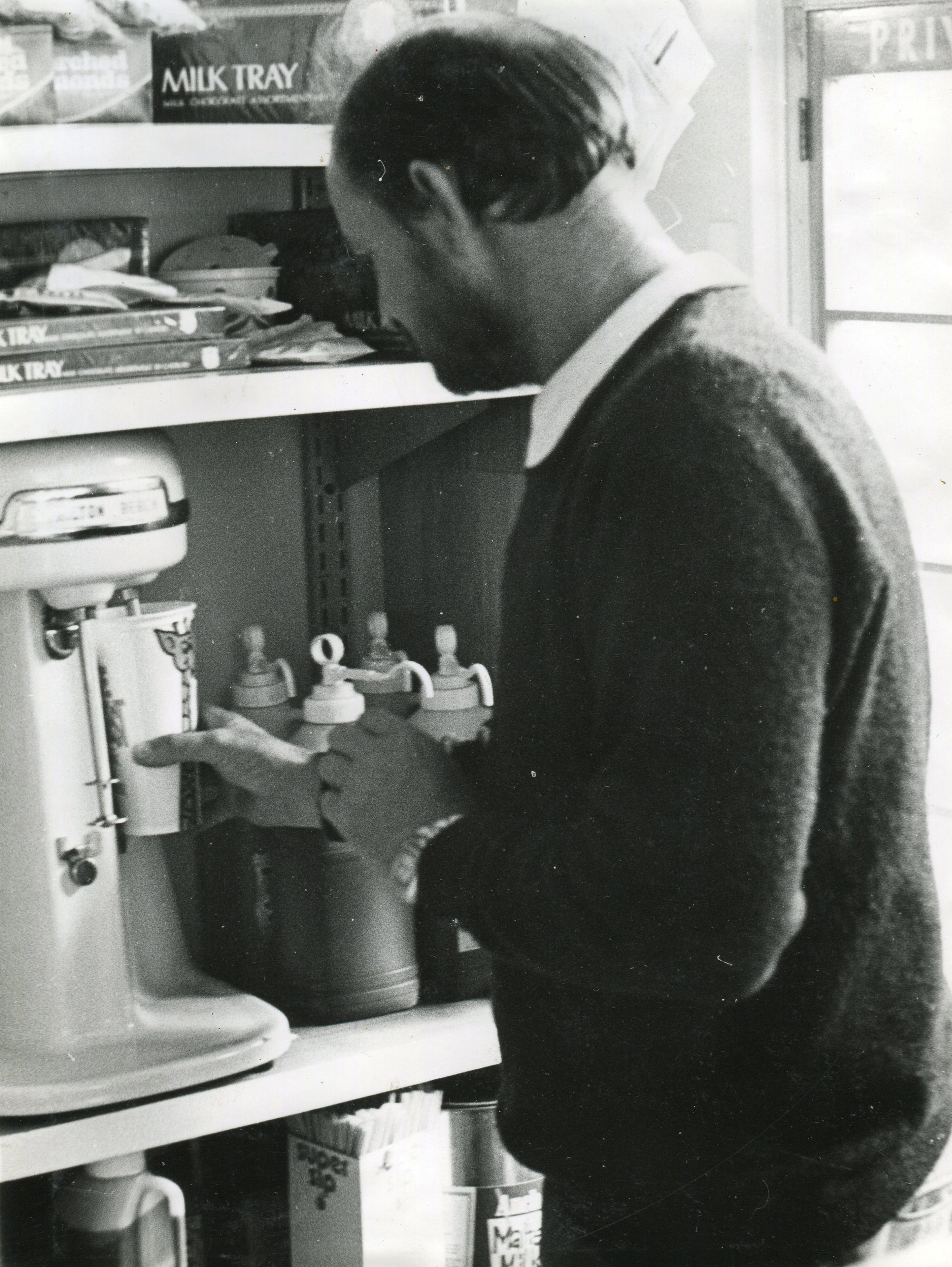 Pinedale Dairy; Mr Baker making a milkshake; ca 1970s