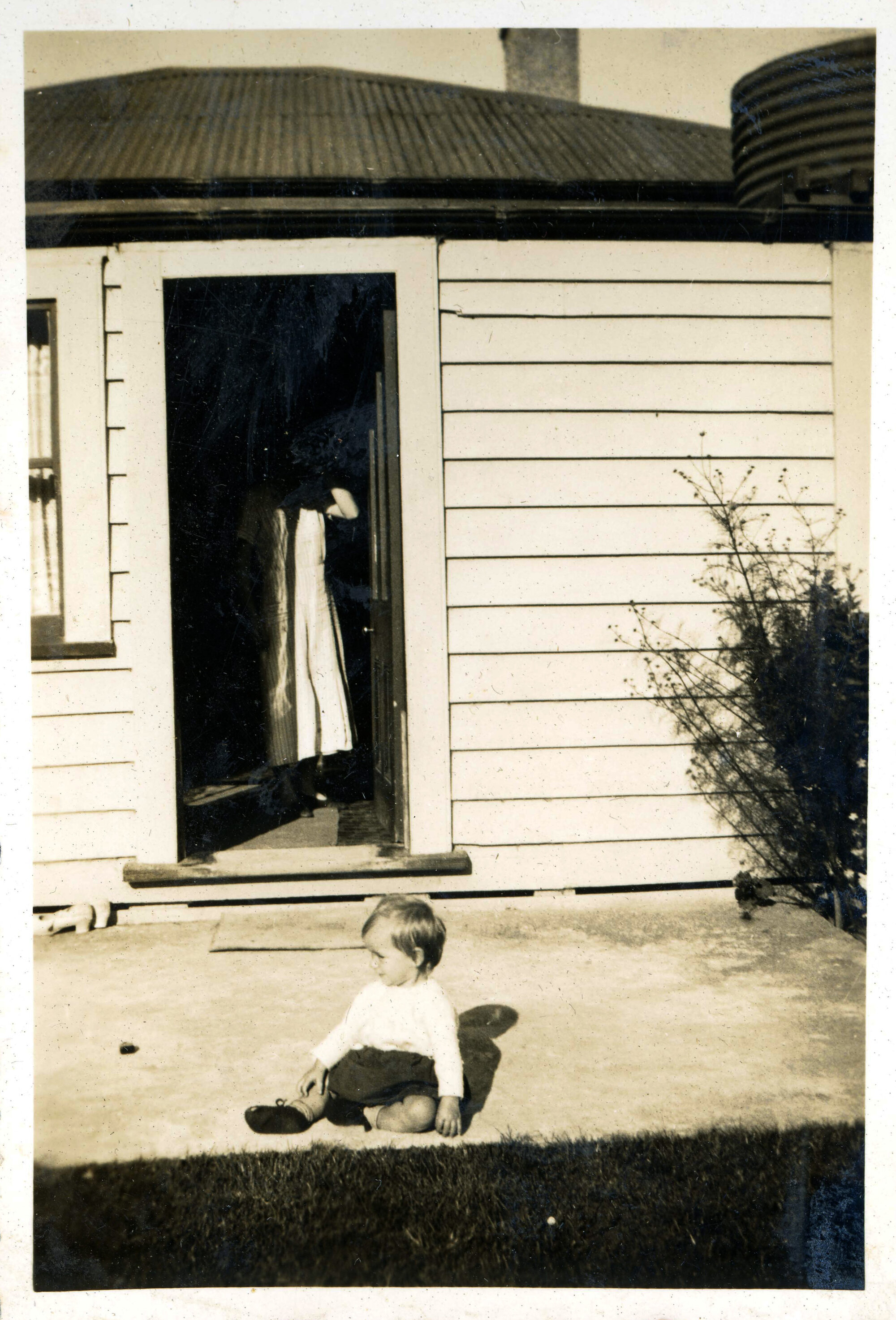 Sharman Marsh Family Photo Album; Toddler Outside House; ca. 1930s