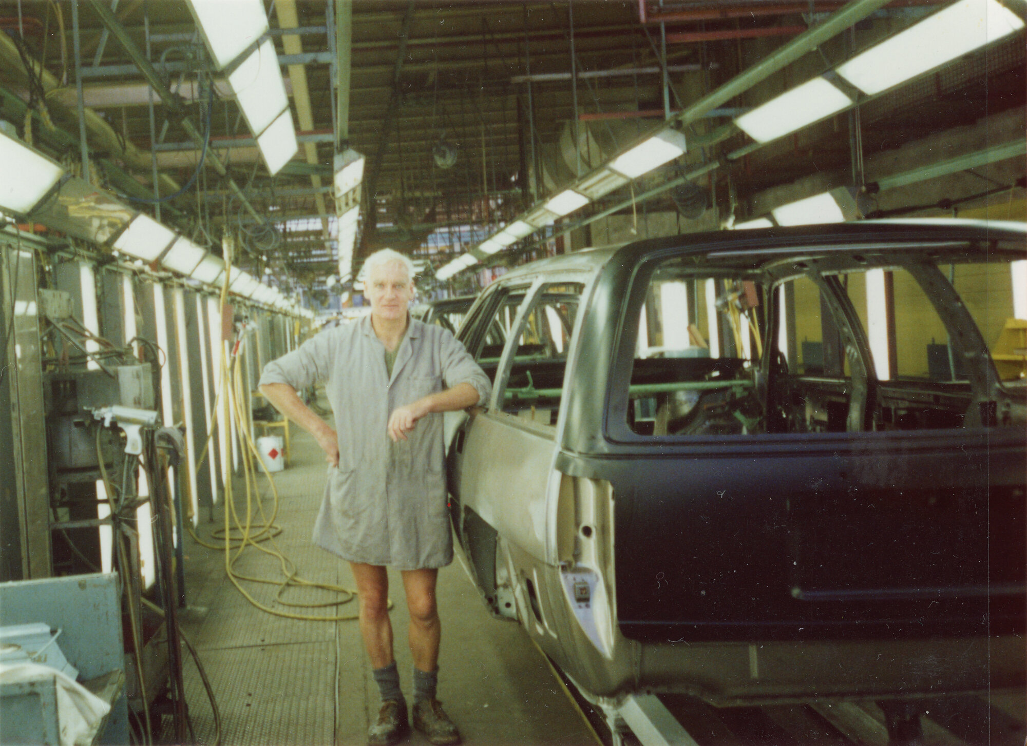 General Motors; Harry Ross on Assembly Line; ca. 1990
