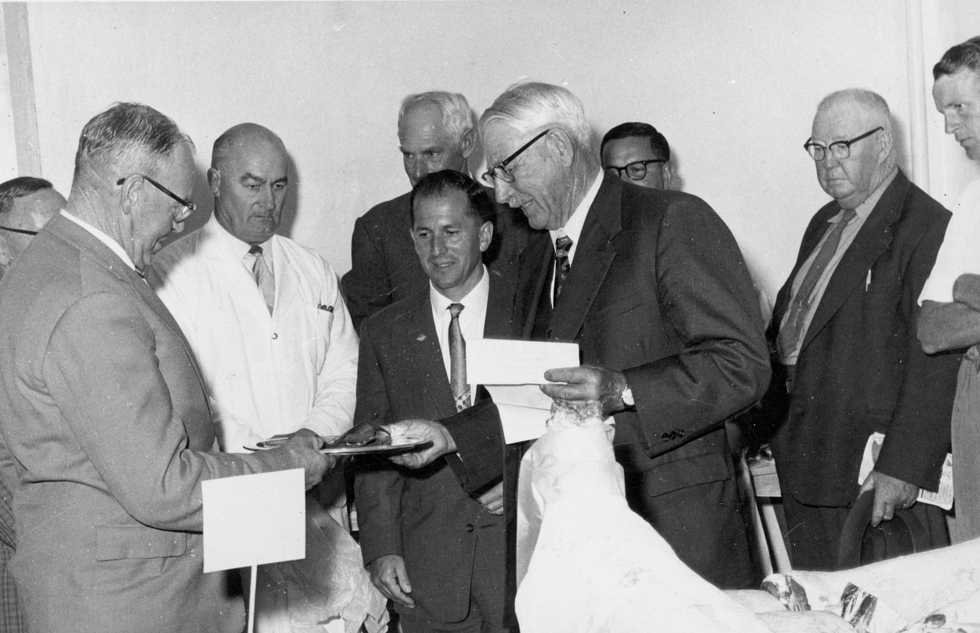 A &amp; P show 1961; jointed meat competition winner being awarded certificate.