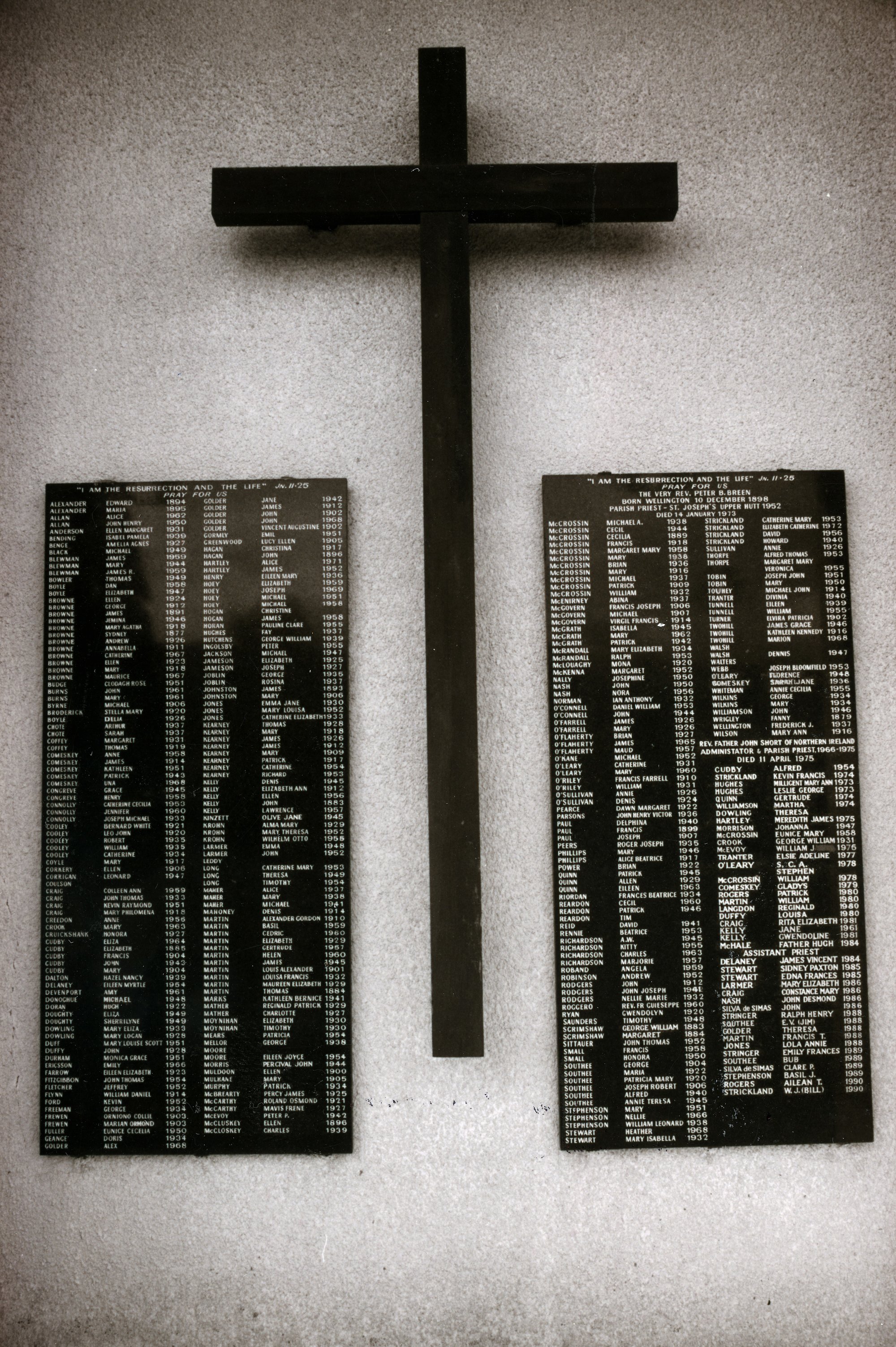 St Joseph's Catholic church of 1965; lawn cemetery memorial plaques.