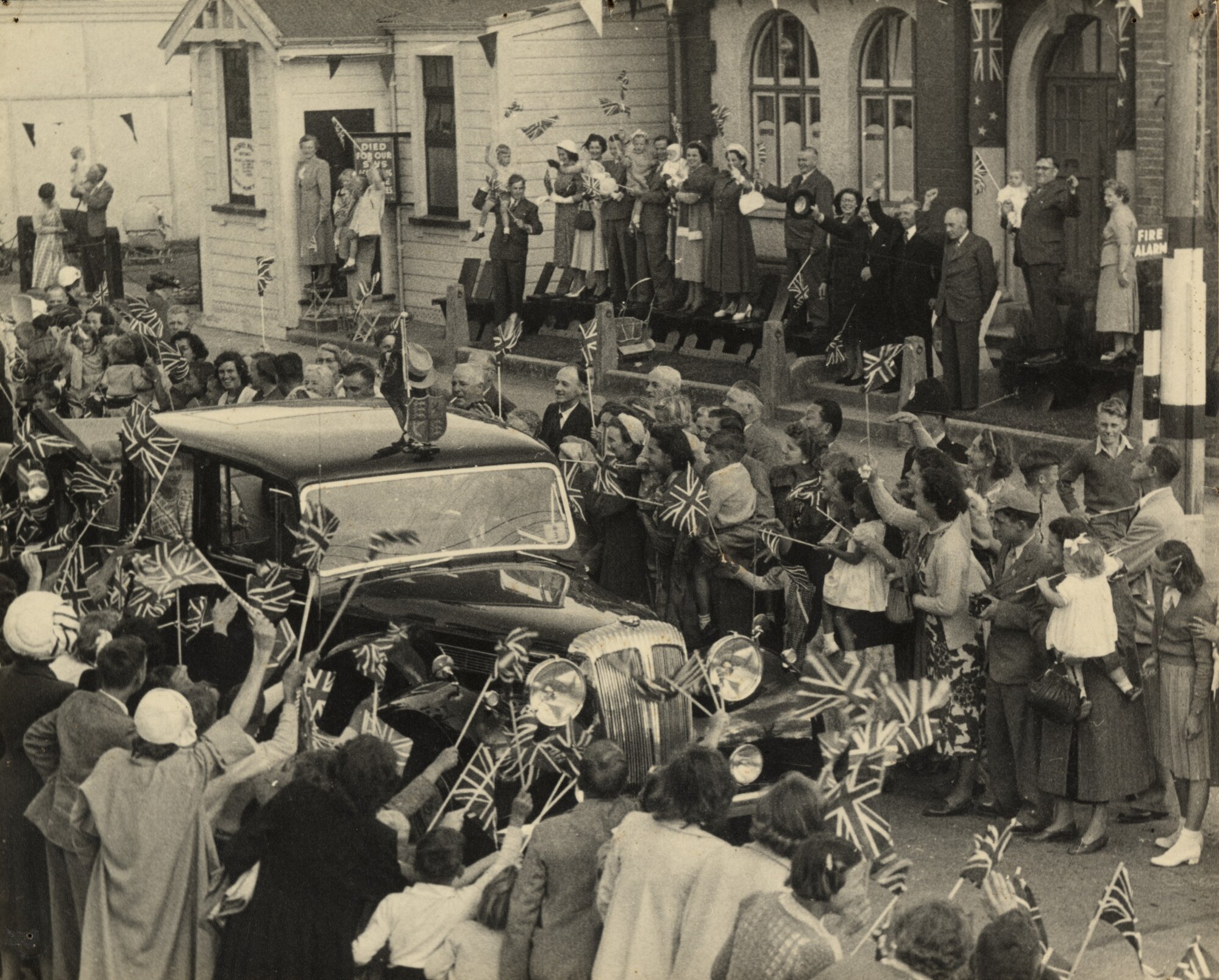 Royal tour 1954; Daimler passing Council Chamber dais, Main Street.