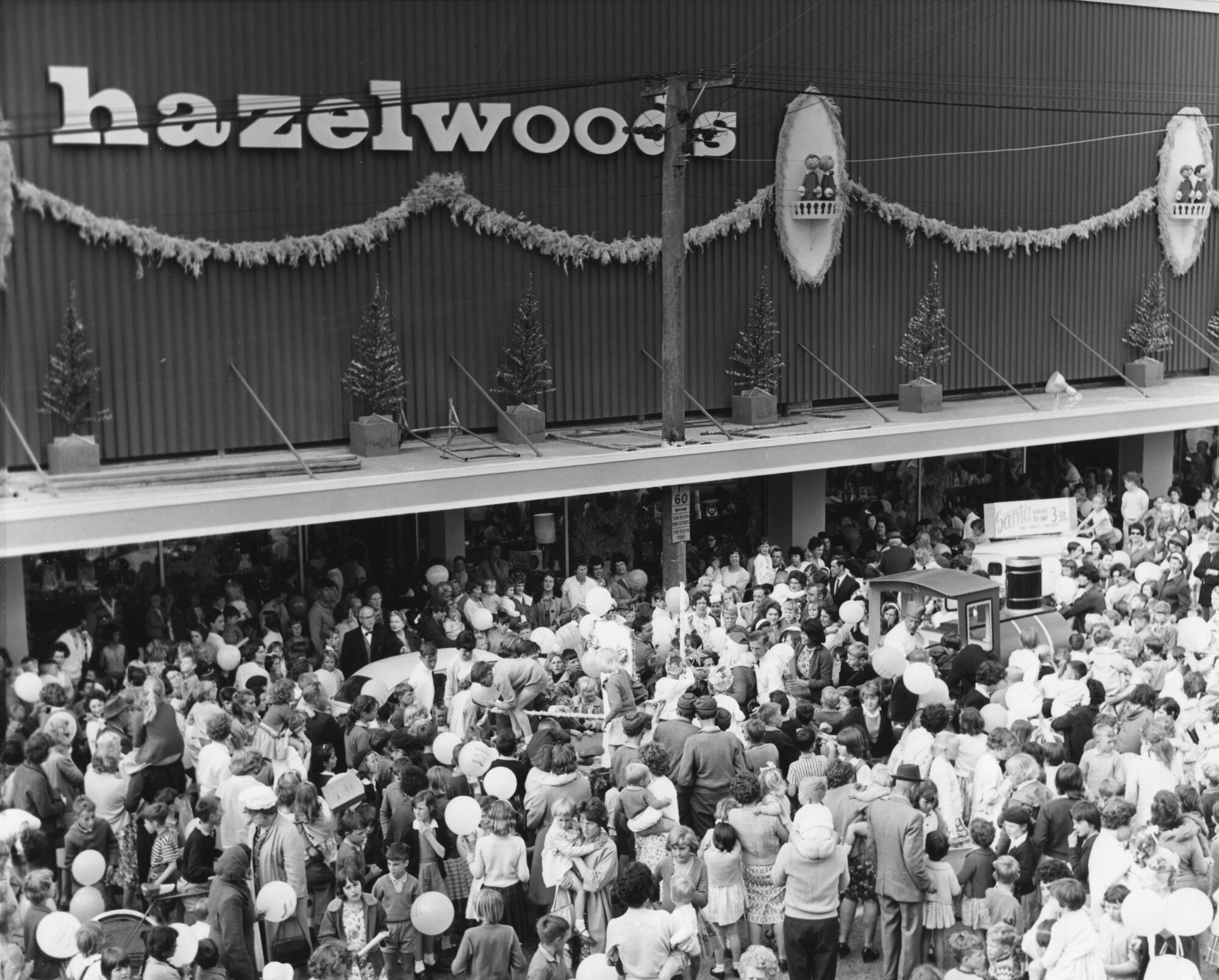 Hazelwoods Father Christmas 1964 (?); train outside store.
