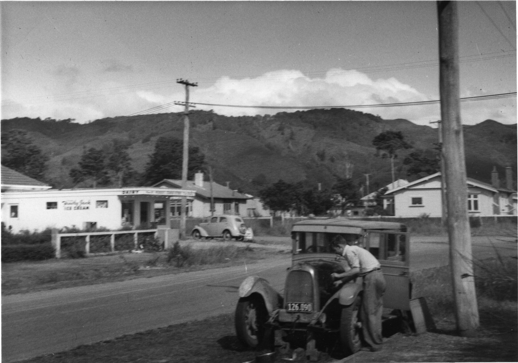 Ararino &amp; Beth streets corner: dairy and cars; 1955.