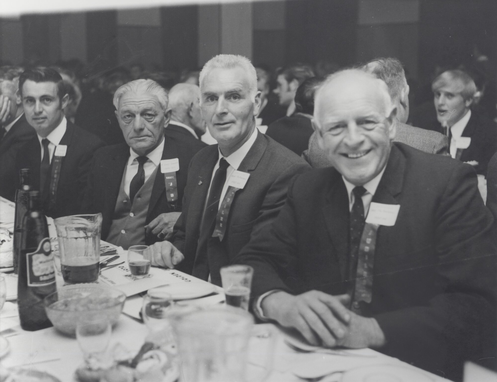 Upper Hutt Rugby Club jubilee dinner group; five identified.