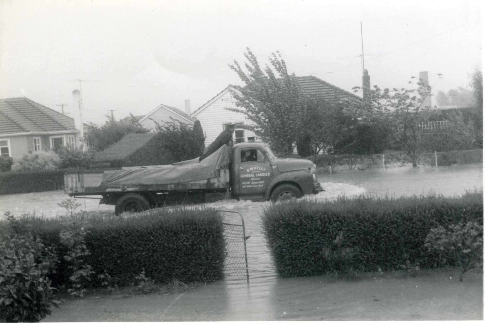 Flood, 1963; view from 32 Moonshine Road, with truck passing.