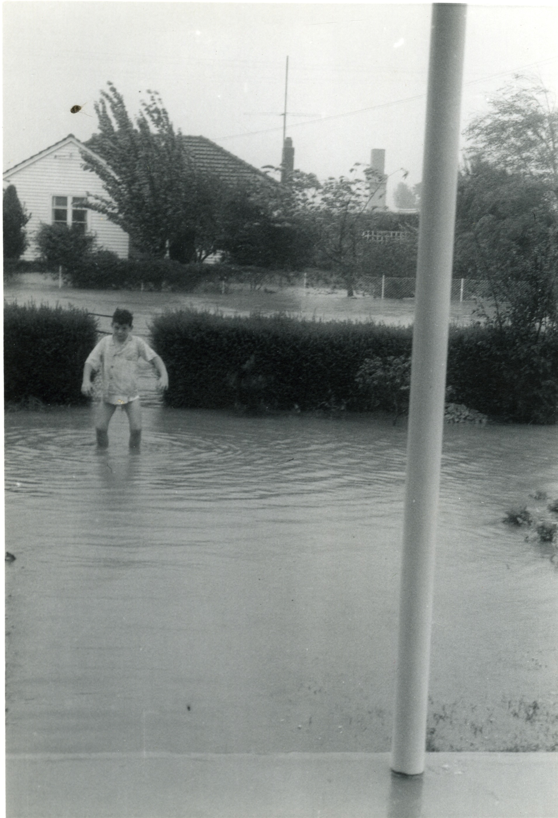 Flood, 1963; Stewart Weddell walking up the 32 Moonshine Road front path.