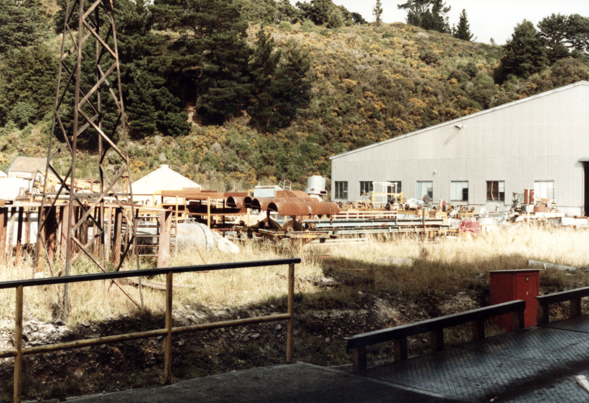Dunlop factory; rubbish between raw material store and radial-tyre section.