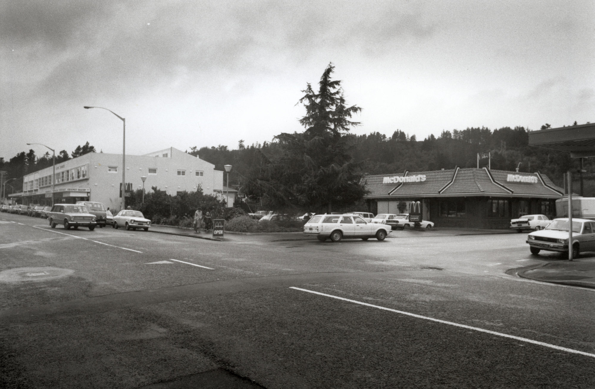 Main Street, south side, east end; McDonald's and Queen's Chambers, from the west.