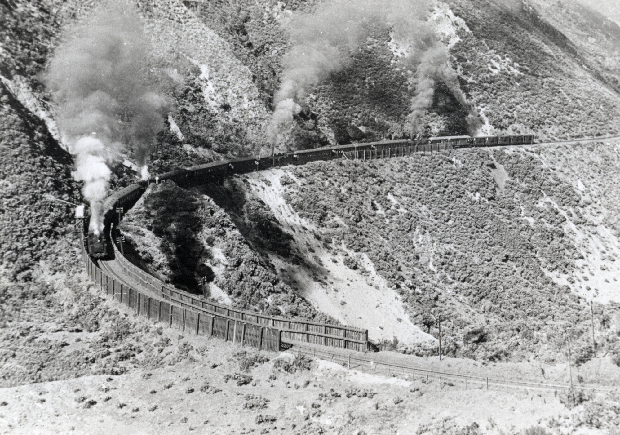 Rimutaka Incline; train rounding 'Siberia' curve (Horseshoe Gully) c1955.  001