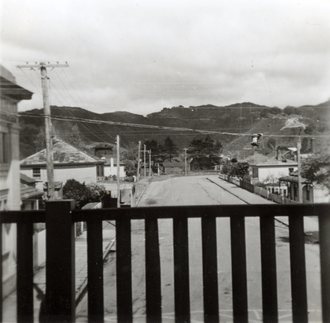 Station Street, from the first floor of the Provincial Hotel; hilltop earthworks for Dunlop reservoir visible.