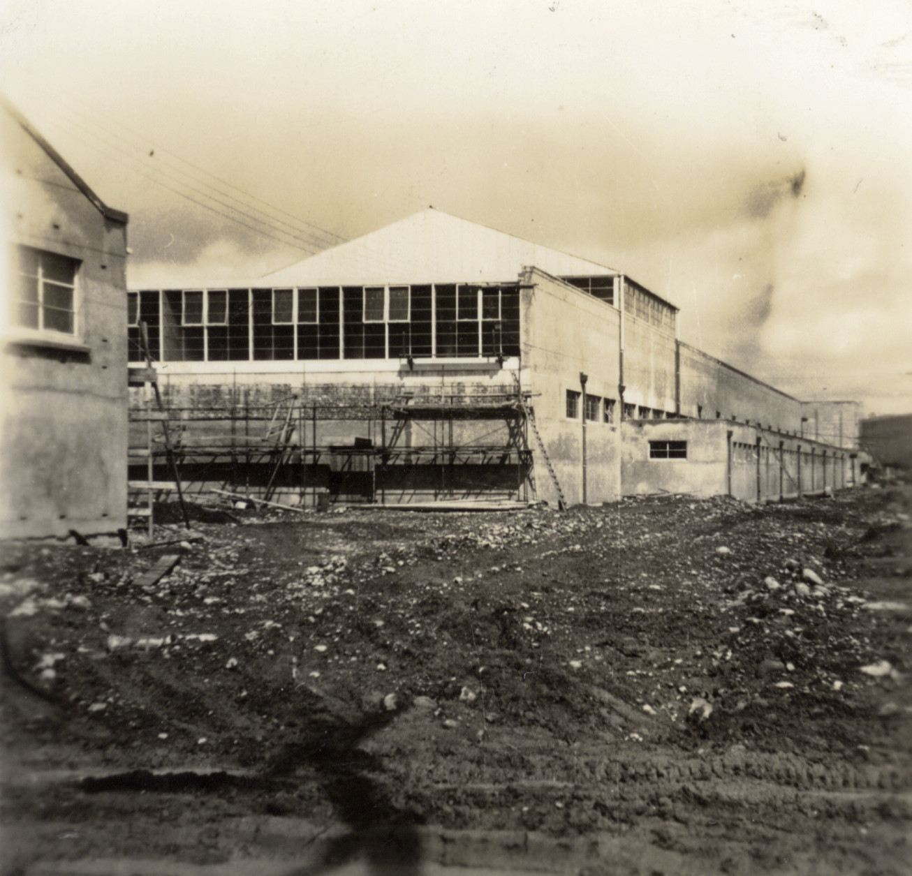 Dunlop factory construction; frontage from the east end; electrical sub-station at left.
