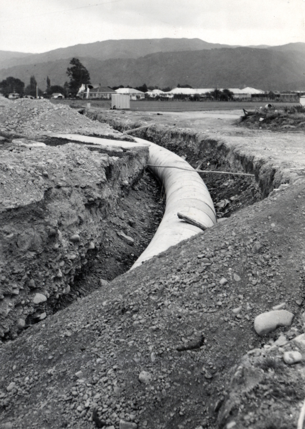 Heretaunga College; stormwater drain curve. River run; backfill in foreground.