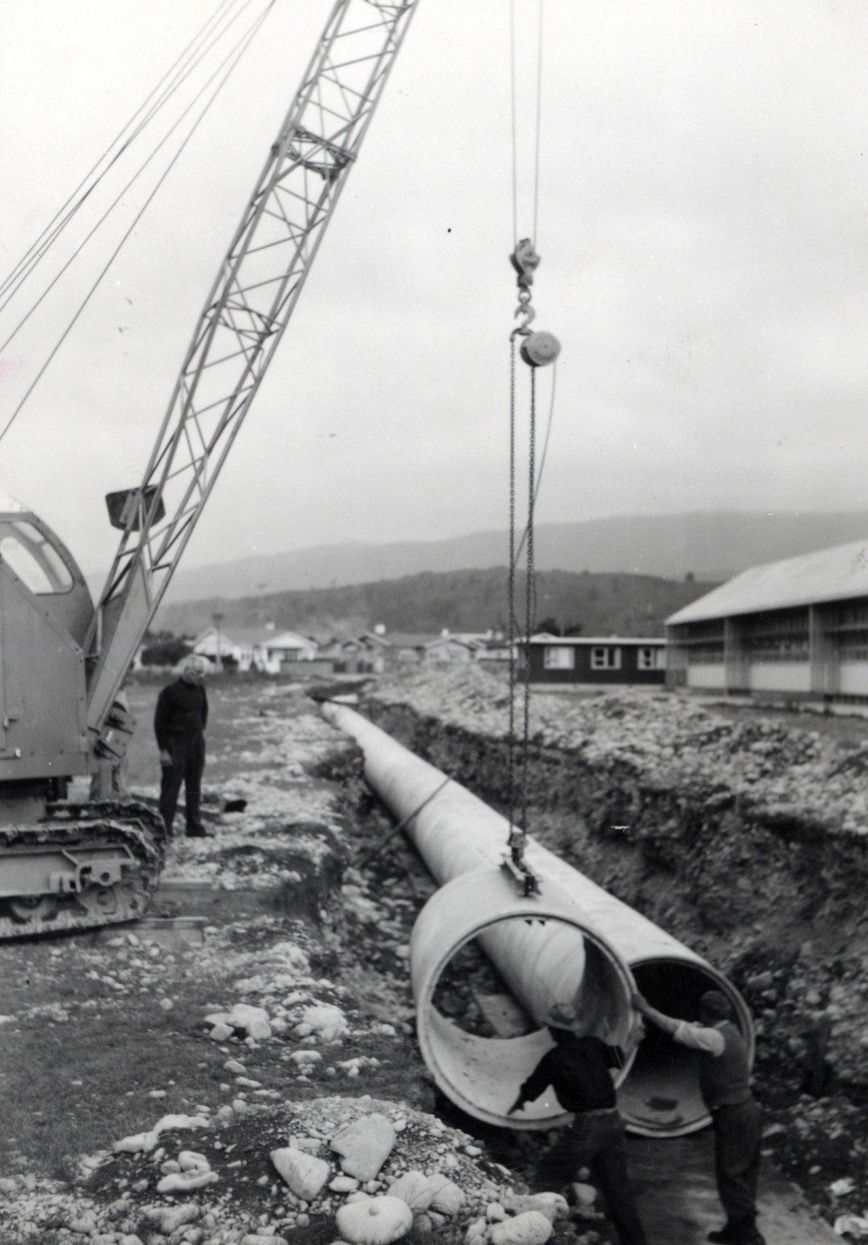 Heretaunga College; stormwater drain; lowering 54" / 8s pipes; Ward Street in the background.