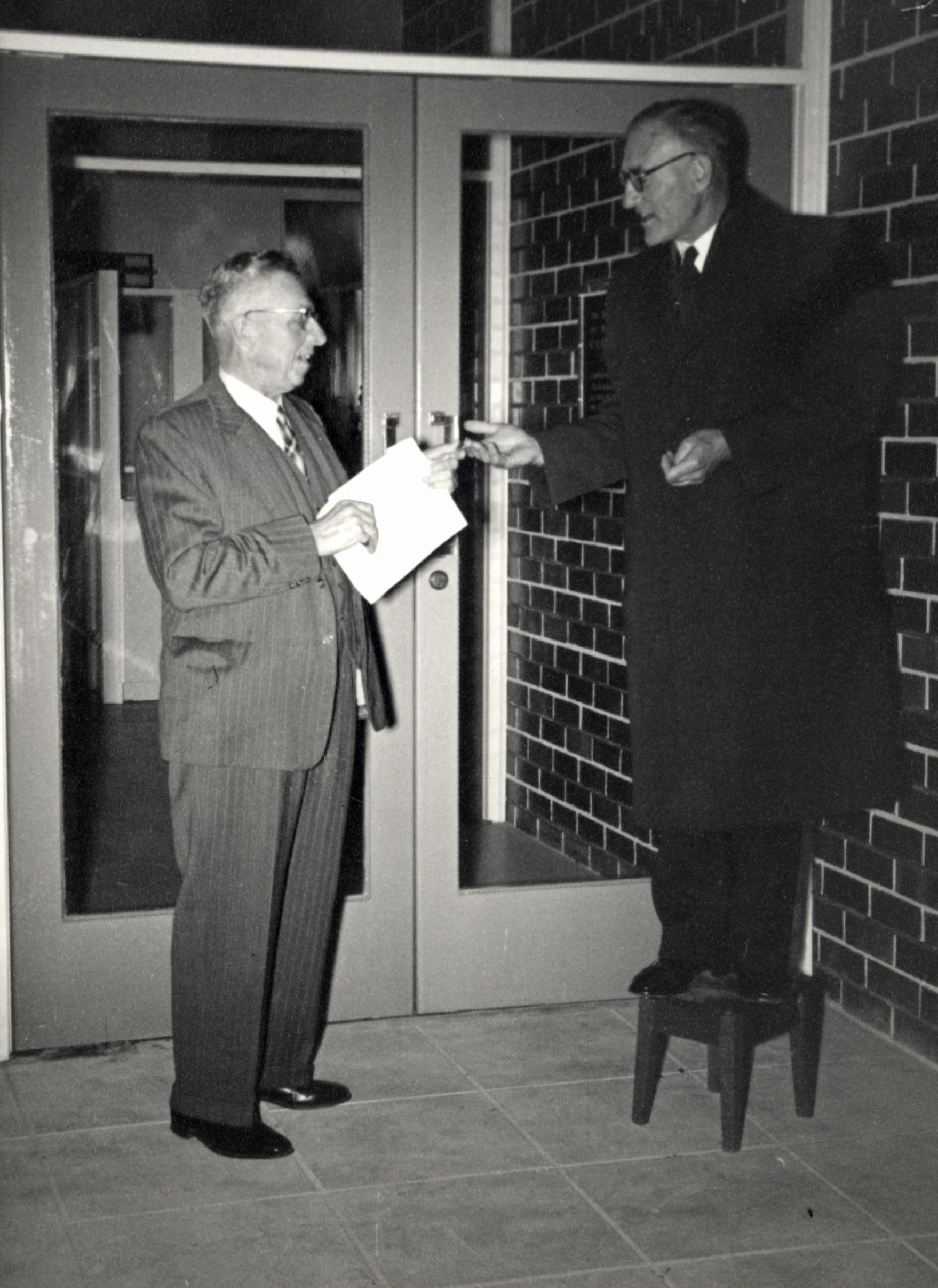 Hapai Club; R H E (Dick) Slacke (Mayor) and T.Craig (Architect) on stool.