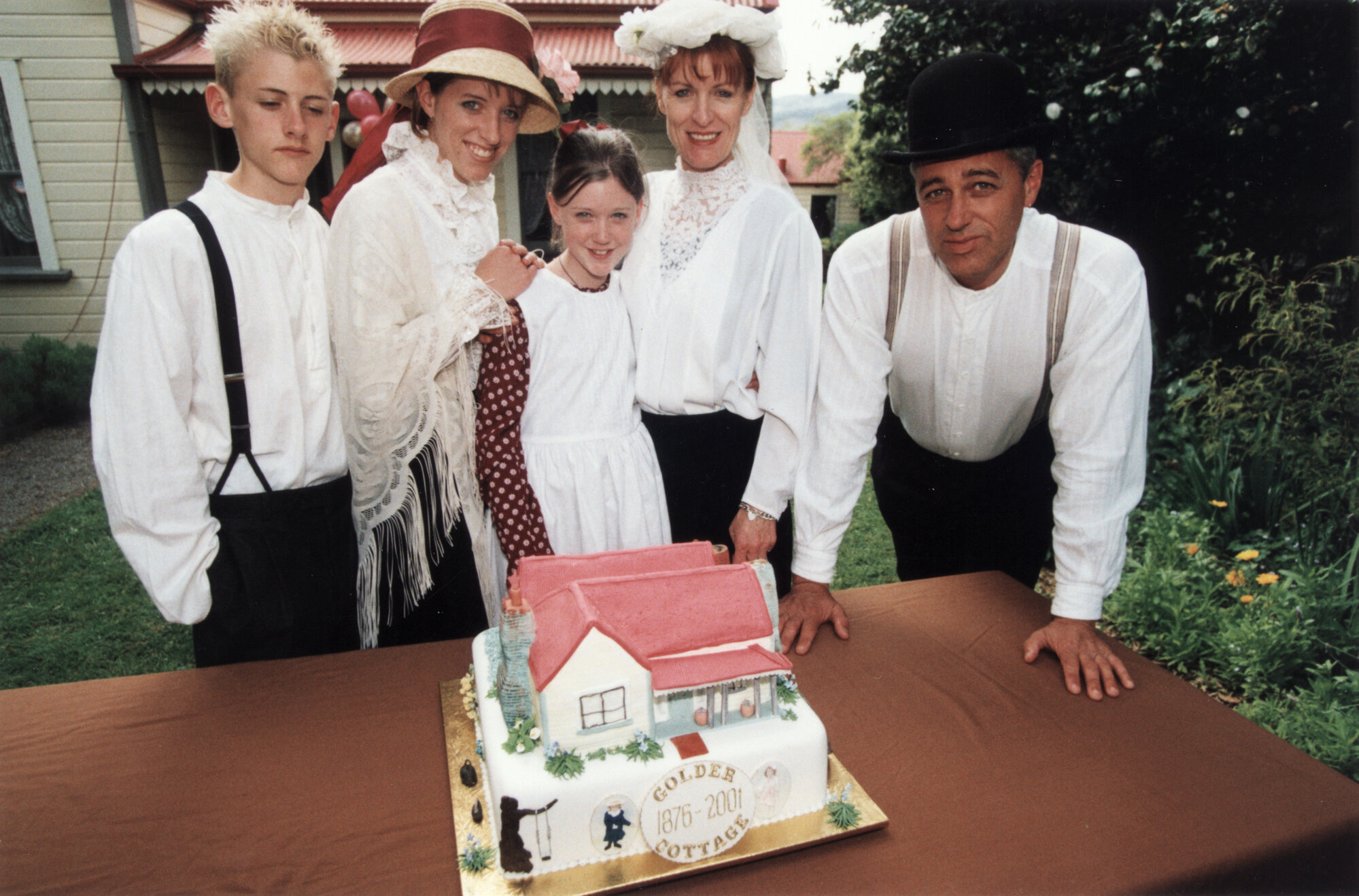 Golders Cottage 125th anniversary; TV's 'Pioneer Family, the 'Feyens', and the anniversary cake.