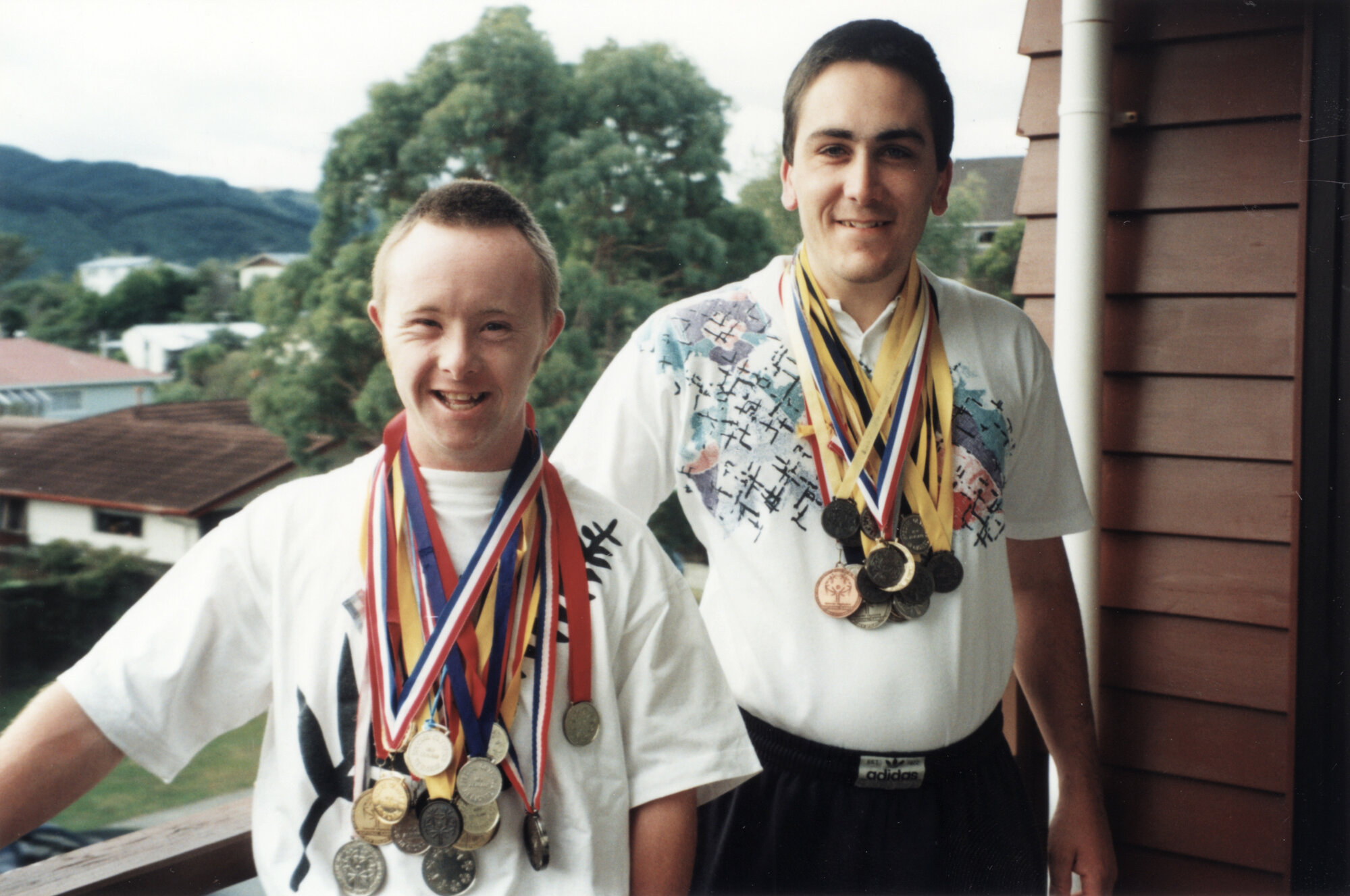 Olympic torch relay runners; Dean Mitchell and Brendan Telfer; both had won Special Olympics medals.
