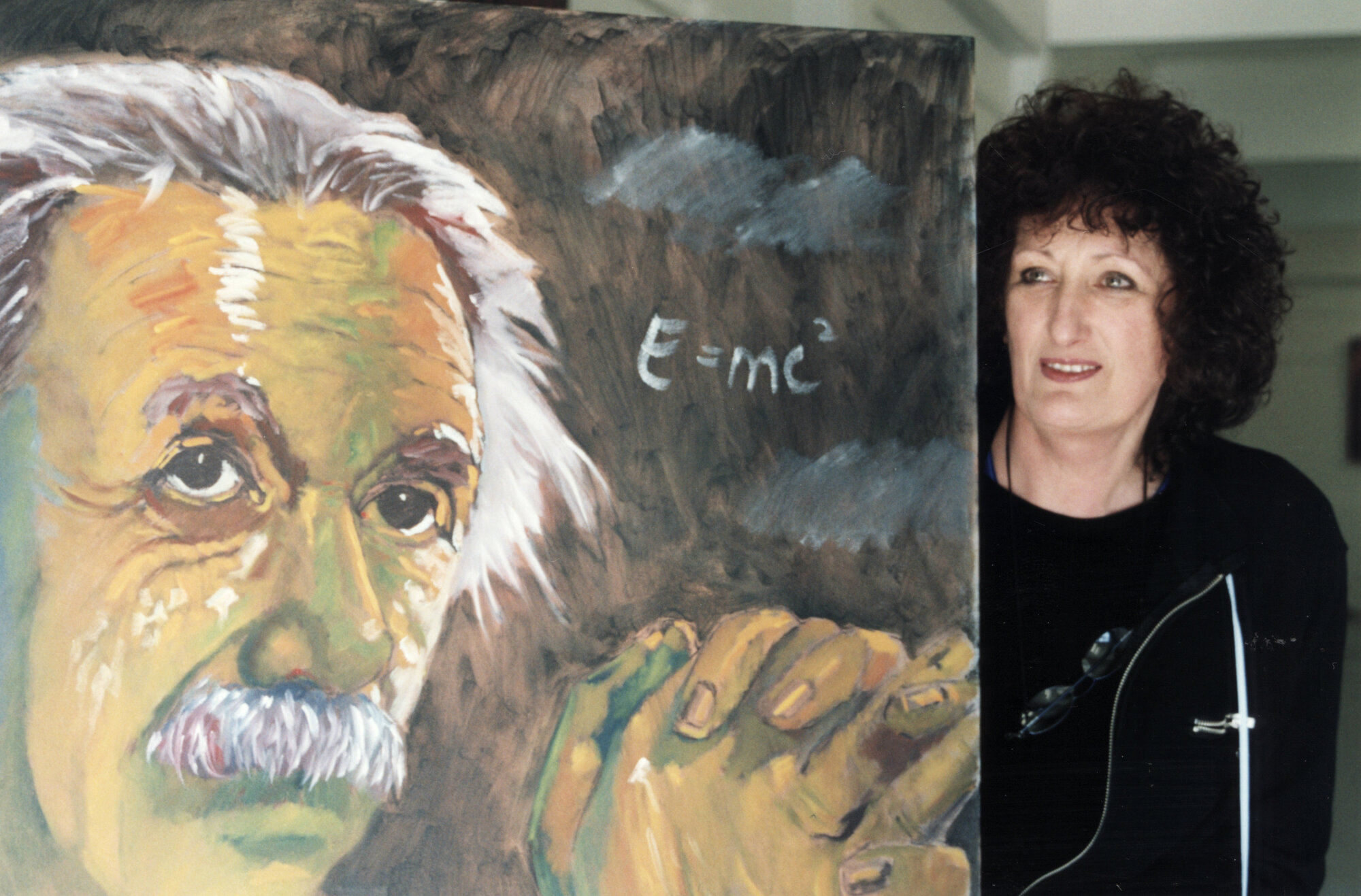 Archibald's Gallery; Mary Archibald with Einstein painting, as part of science festival exhibition.