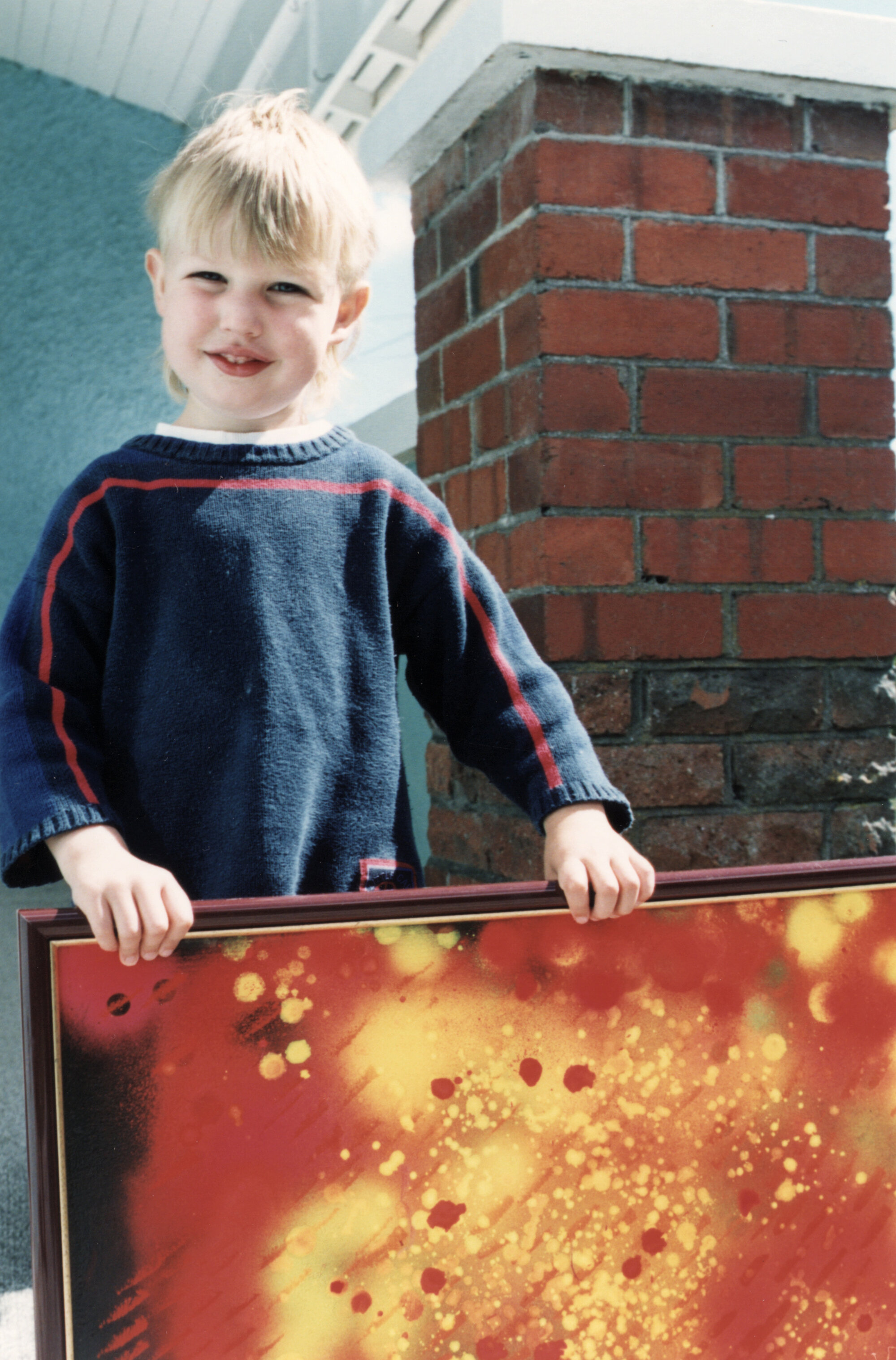 Community Gallery; John Reichel; posthumous display; Josh Krynen with a painting.