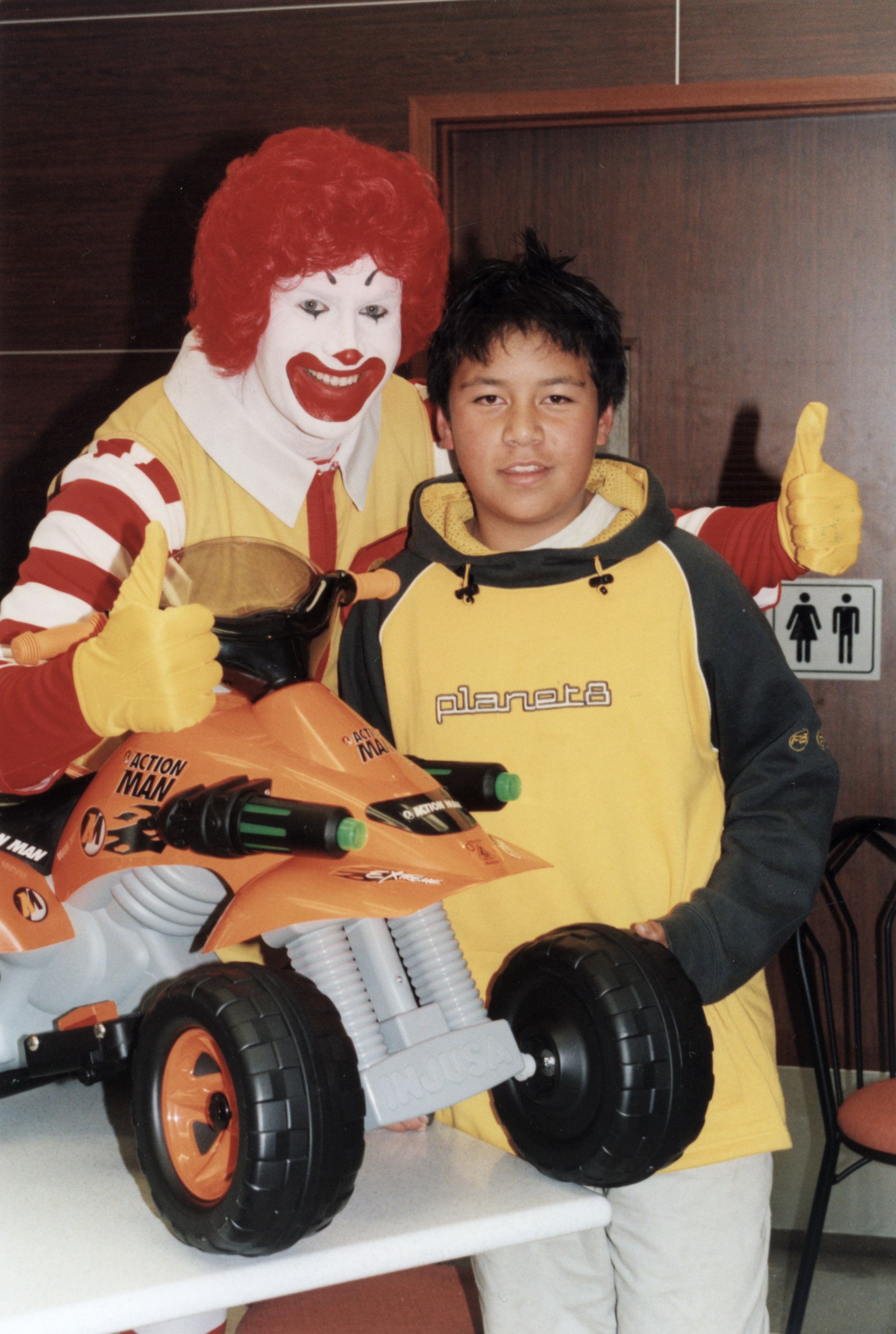 McDonald's re-opens after refurbishment; Walter Treviranus, 12, wins draw for Action Man quad bike.