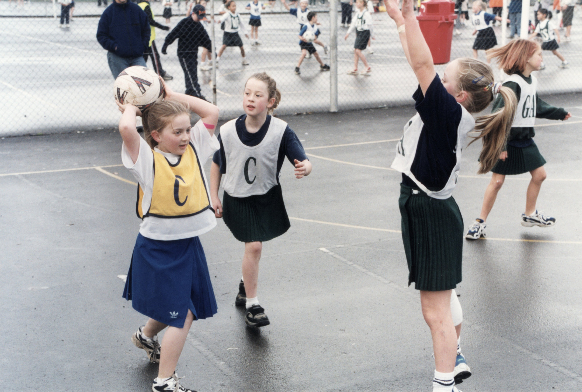 Netball; St Brendan's 'Foxies' in green, 11, Plateau School, gold, 2.