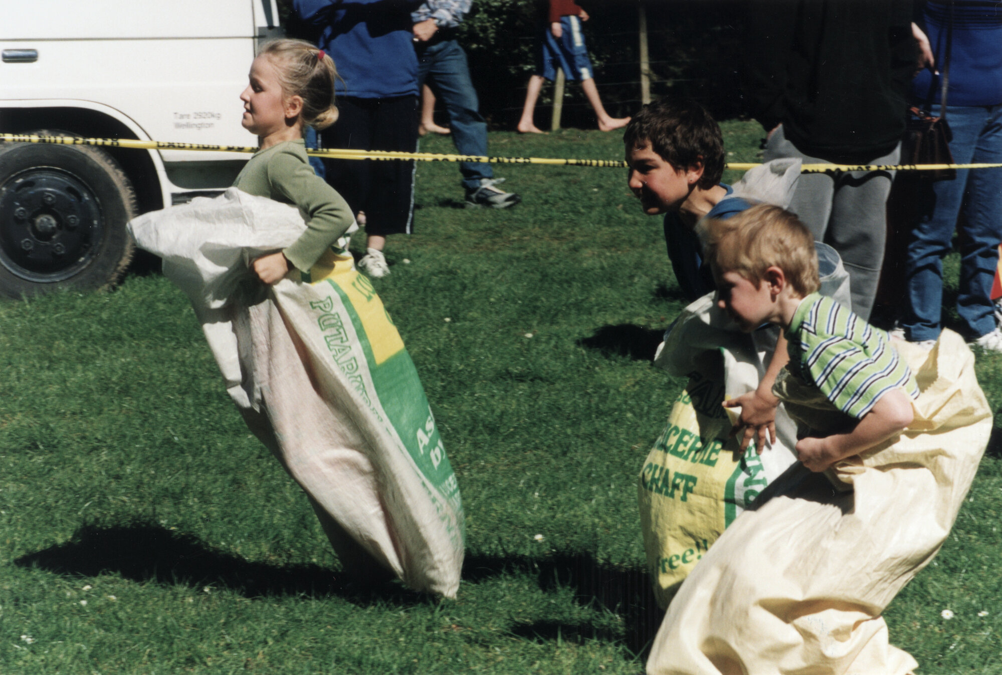 Highland Gathering, 2002, Harcourt Park; sack racers, unidentified.