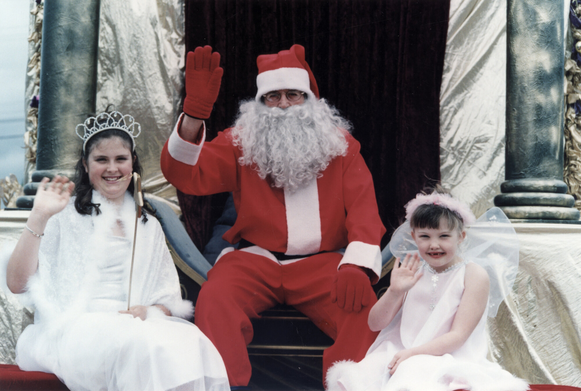 Christmas parade 2003; snow princess Anna, Santa, fairy Piper.