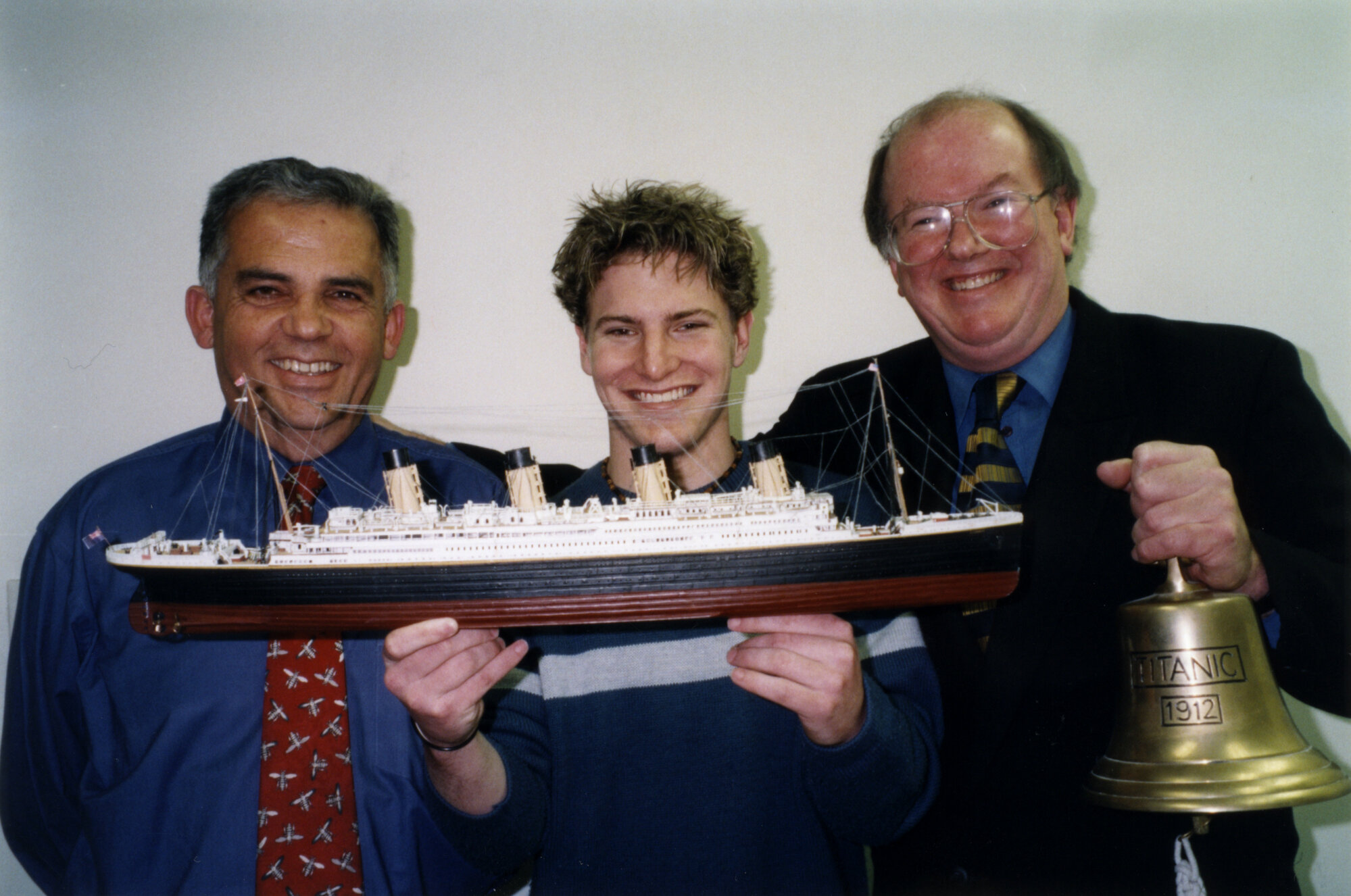 Titanic enthusiasts Michael Bissett, Nigel Bryant, Brian Reeves, with model and replica bell..