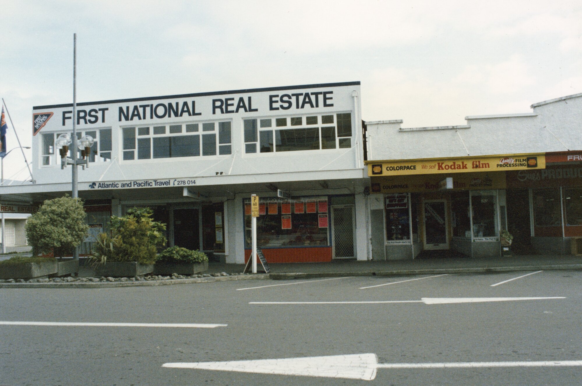 Main Street 1989  2; No. 75-87; First National Real Estate, Atlantic and Pacific Travel, Colorpace. [P2-854-1999]