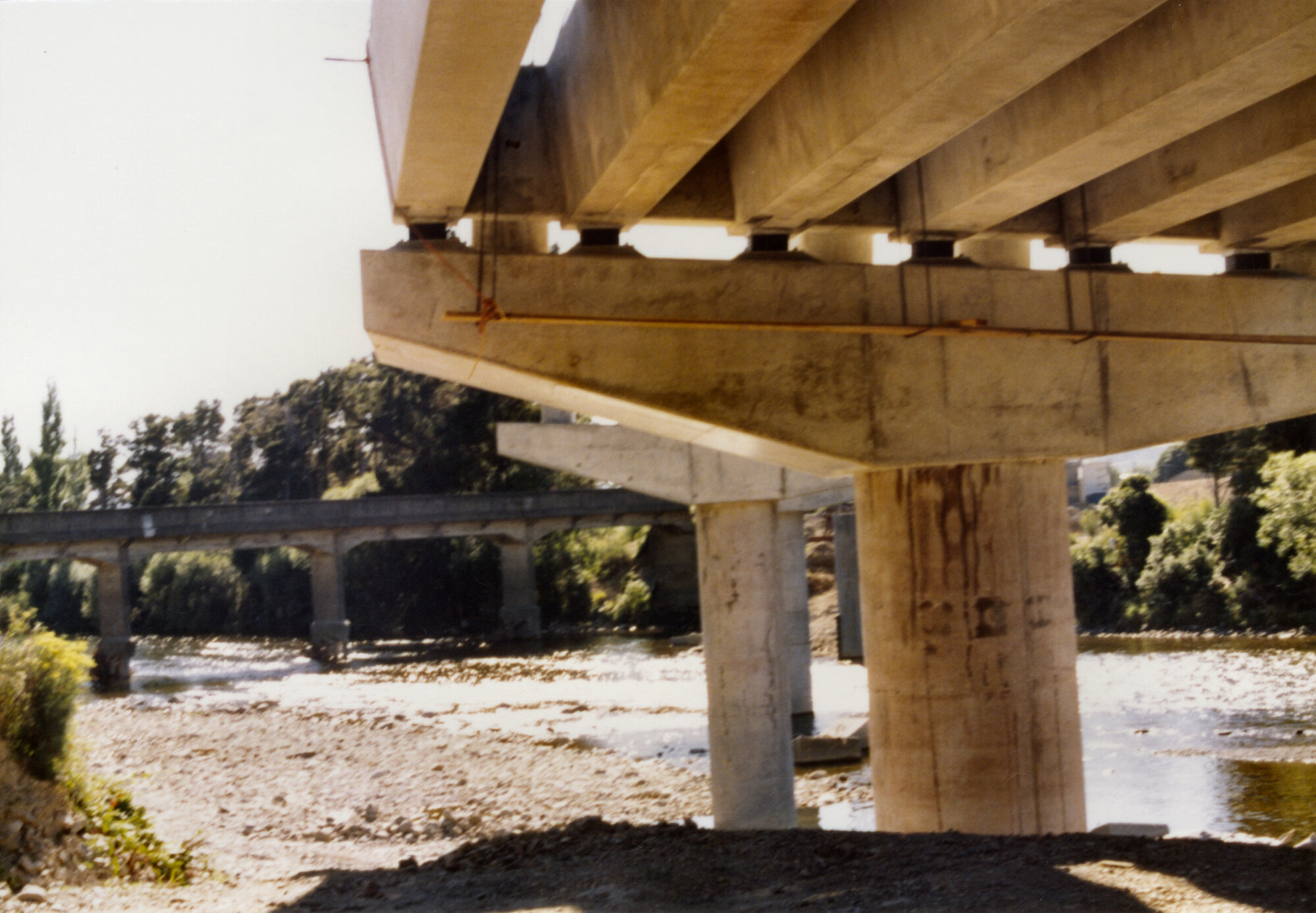 Moonshine bridges; new State Highway 2 bridge; deck beams beginning; old bridge in background