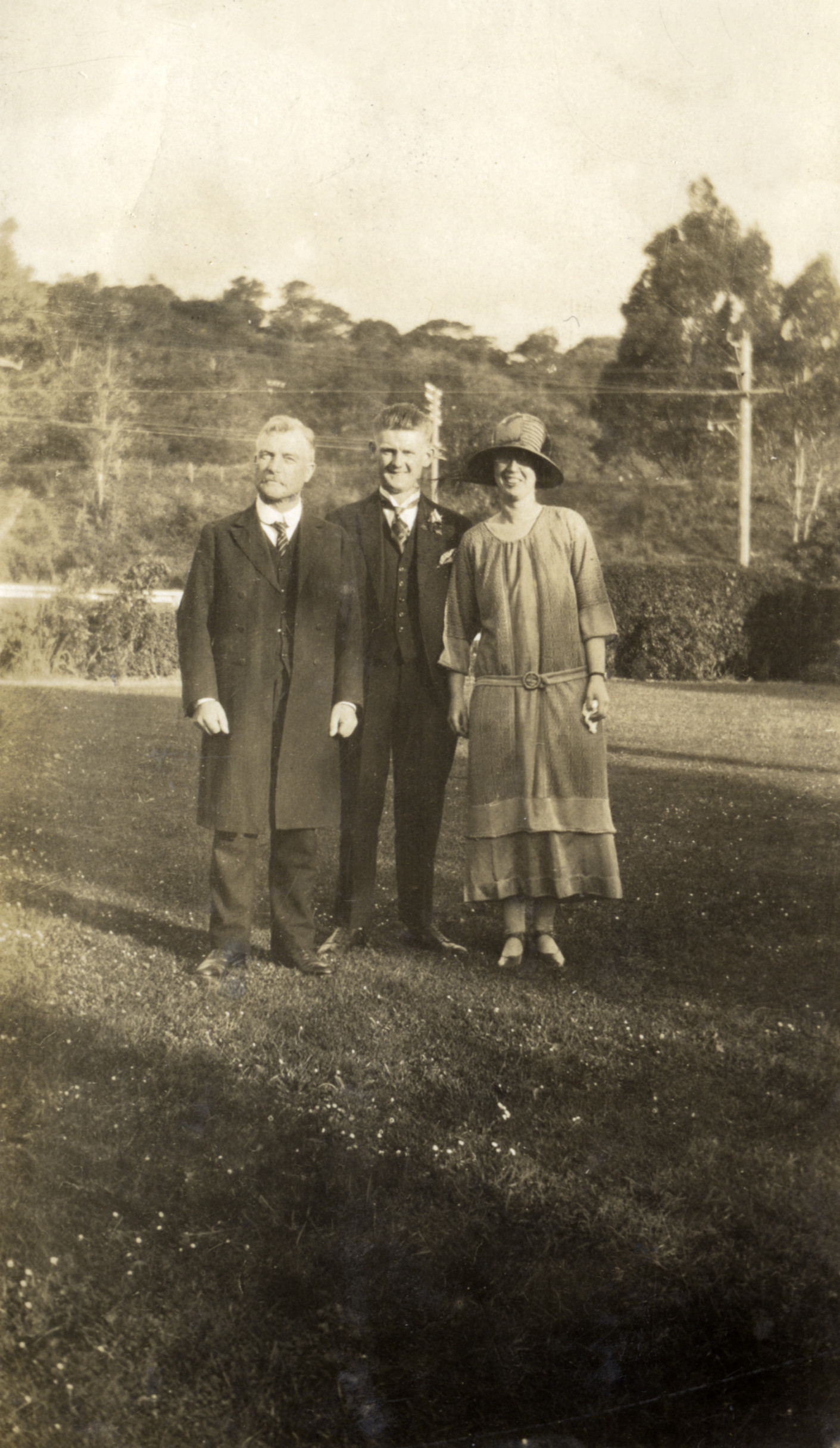 Hazelwood family; wedding 2; groom's father(?) with unidentified bride and groom, at J A Hazelwood's. 