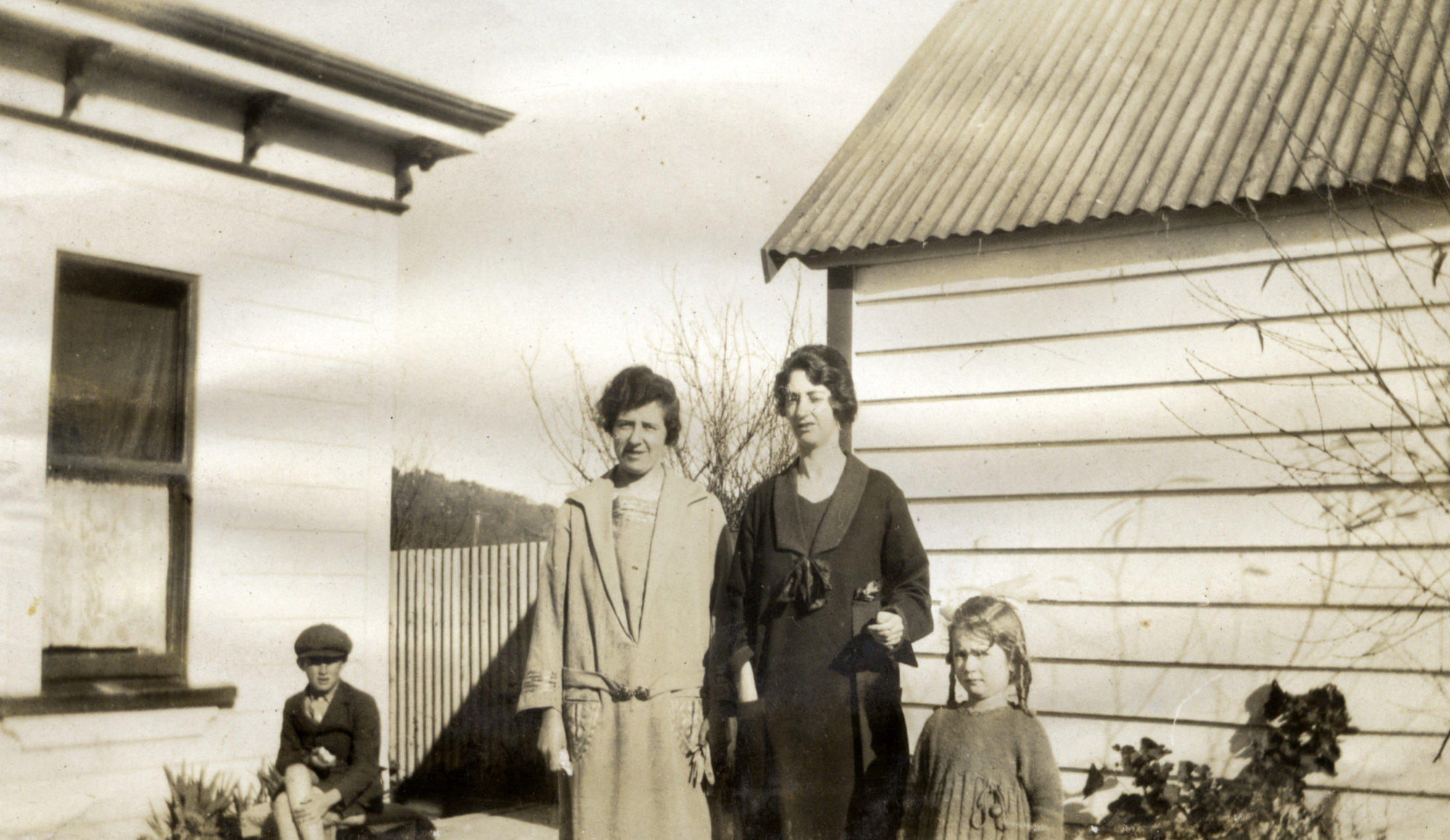 Poulson family; Hilda at left, May and daughter Eda; 'Tom'?