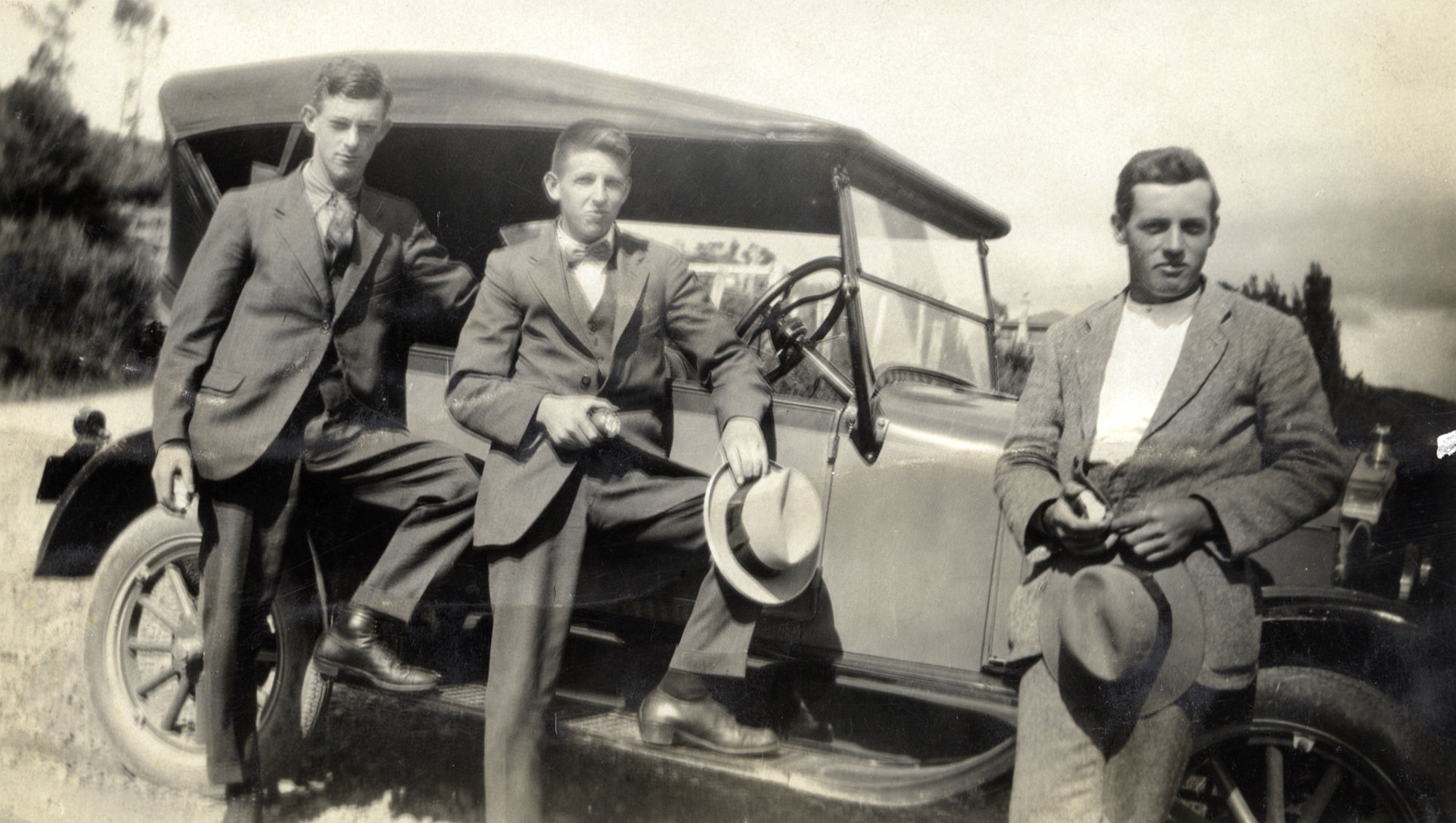 Hector and Jim Hazelwood, Hector Poulson, and Ford Model T car.
