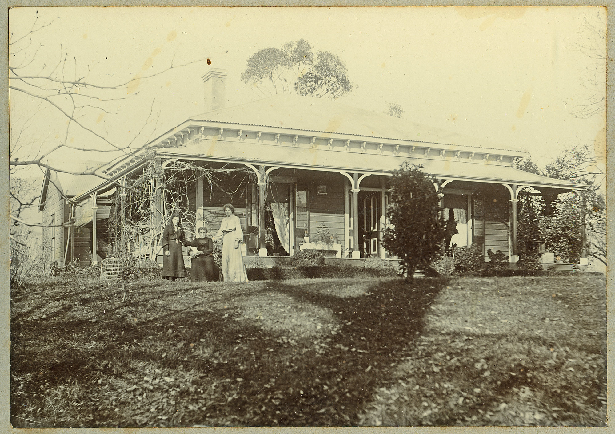 Unidentified house and women