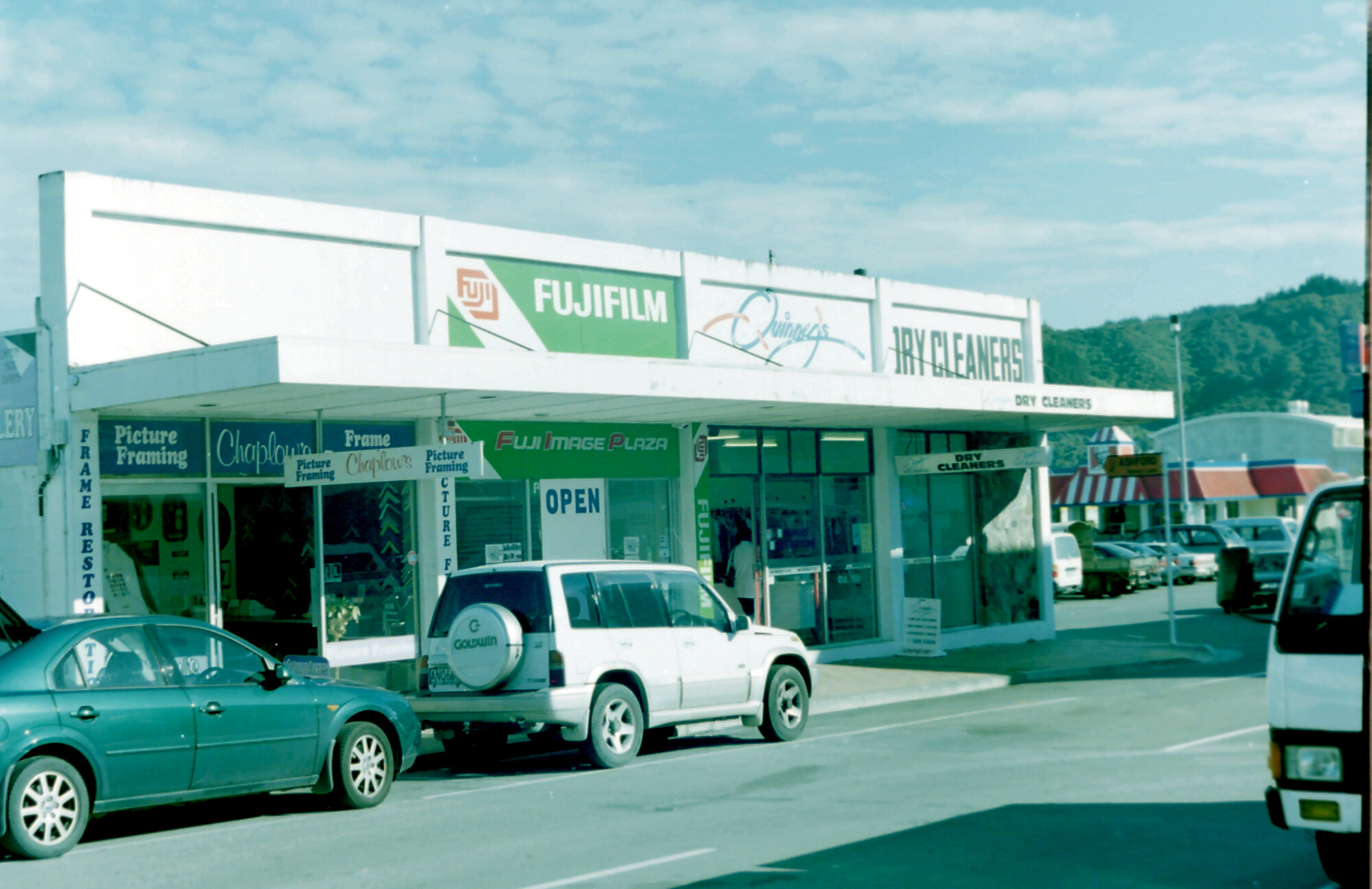 Upper Logan Street; shops on west side.