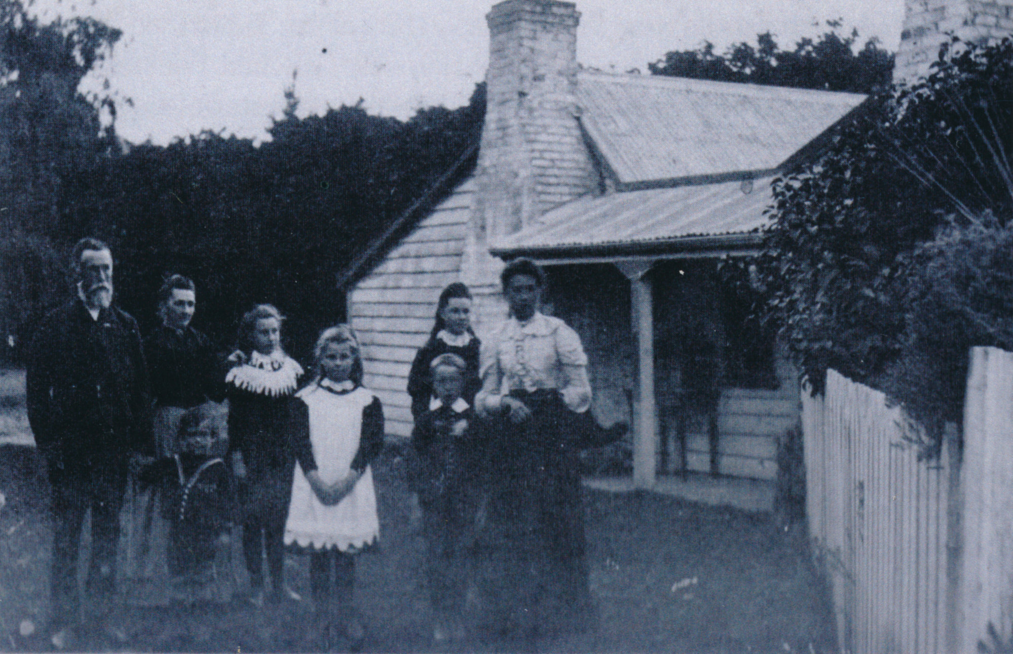 Andrew and Ellen Brown with six of their children outside their cottage, c. 1870s