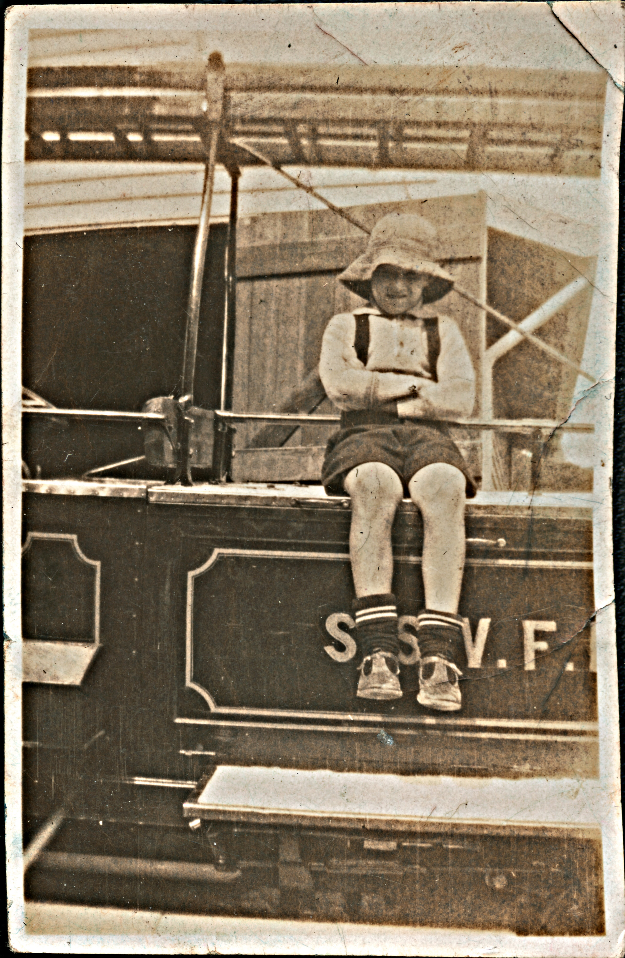 Frederick Goodland [?] Sitting on Silverstream Volunteer Fire Brigade Appliance; ca. 1931