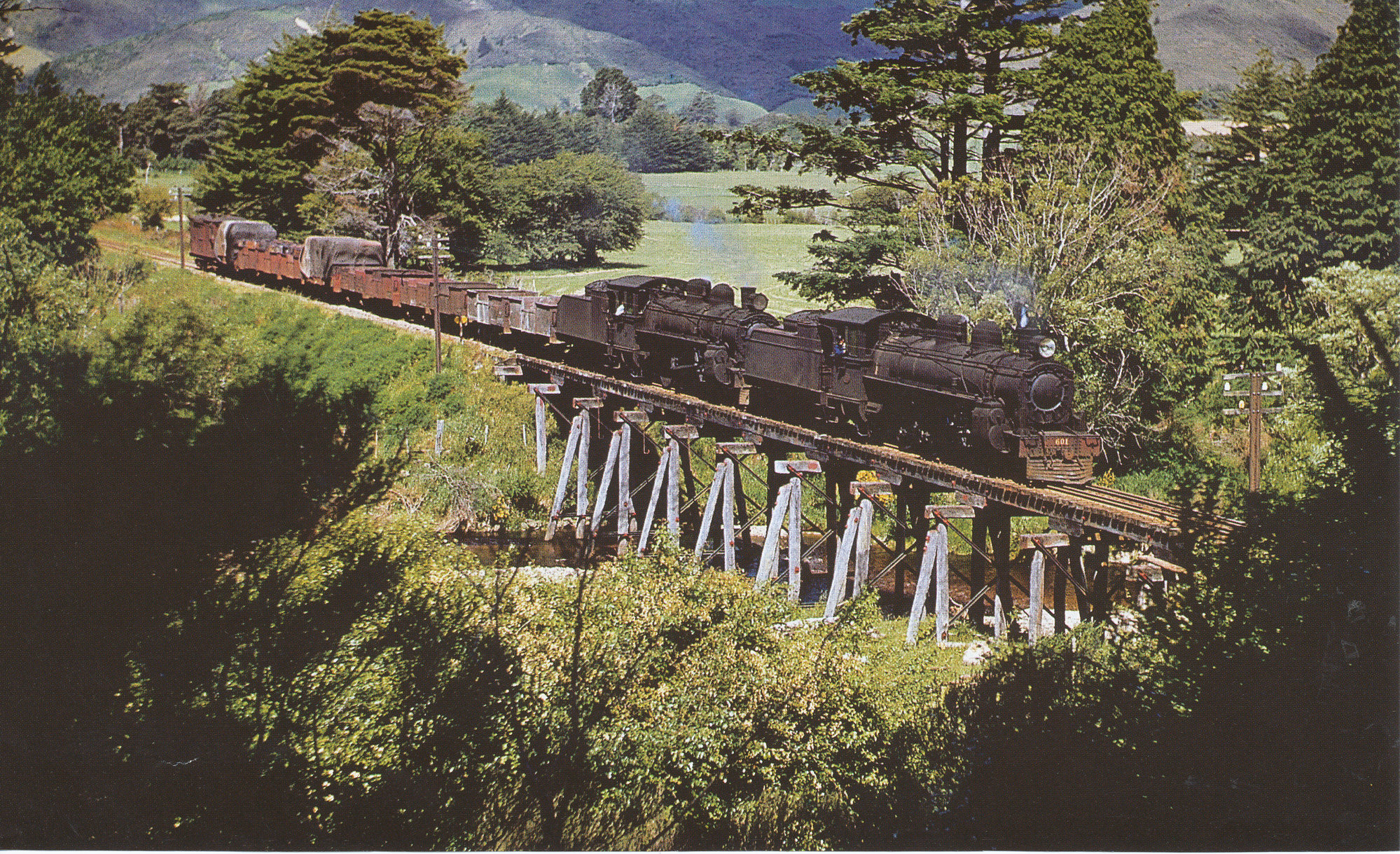 Locomotives A-601 and A-606 with goods train; southbound on Mangaroa River bridge -1953.