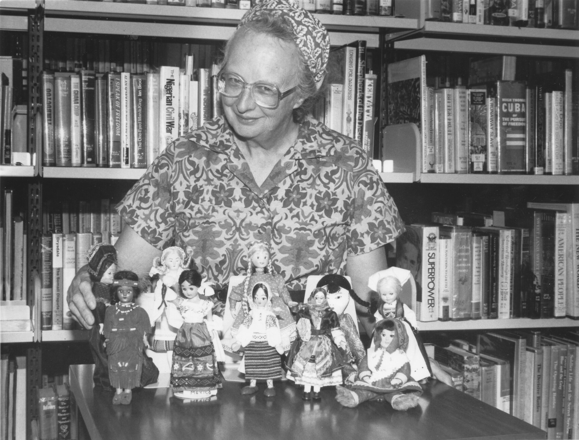 Audrey Harper and dolls for display in children's library.