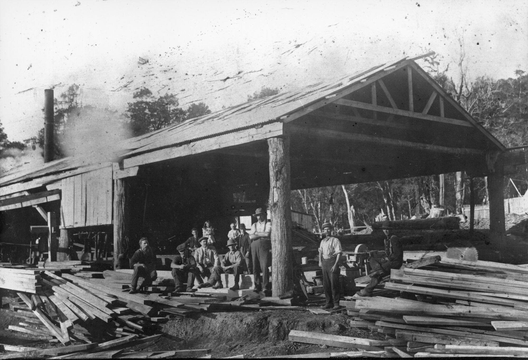 Timber industry; saw mill scene with eleven staff posing for photograph. [P3-5-9]