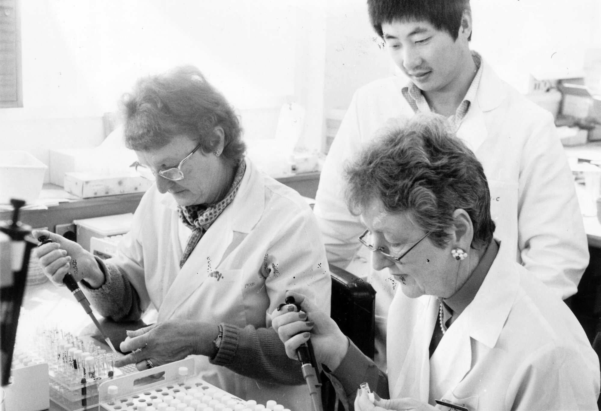 Wallaceville Research Centre; blood samples for sheep going to China tested by Betty McMillan and Mavis Daniel, watched by Chengfeng Zhou.