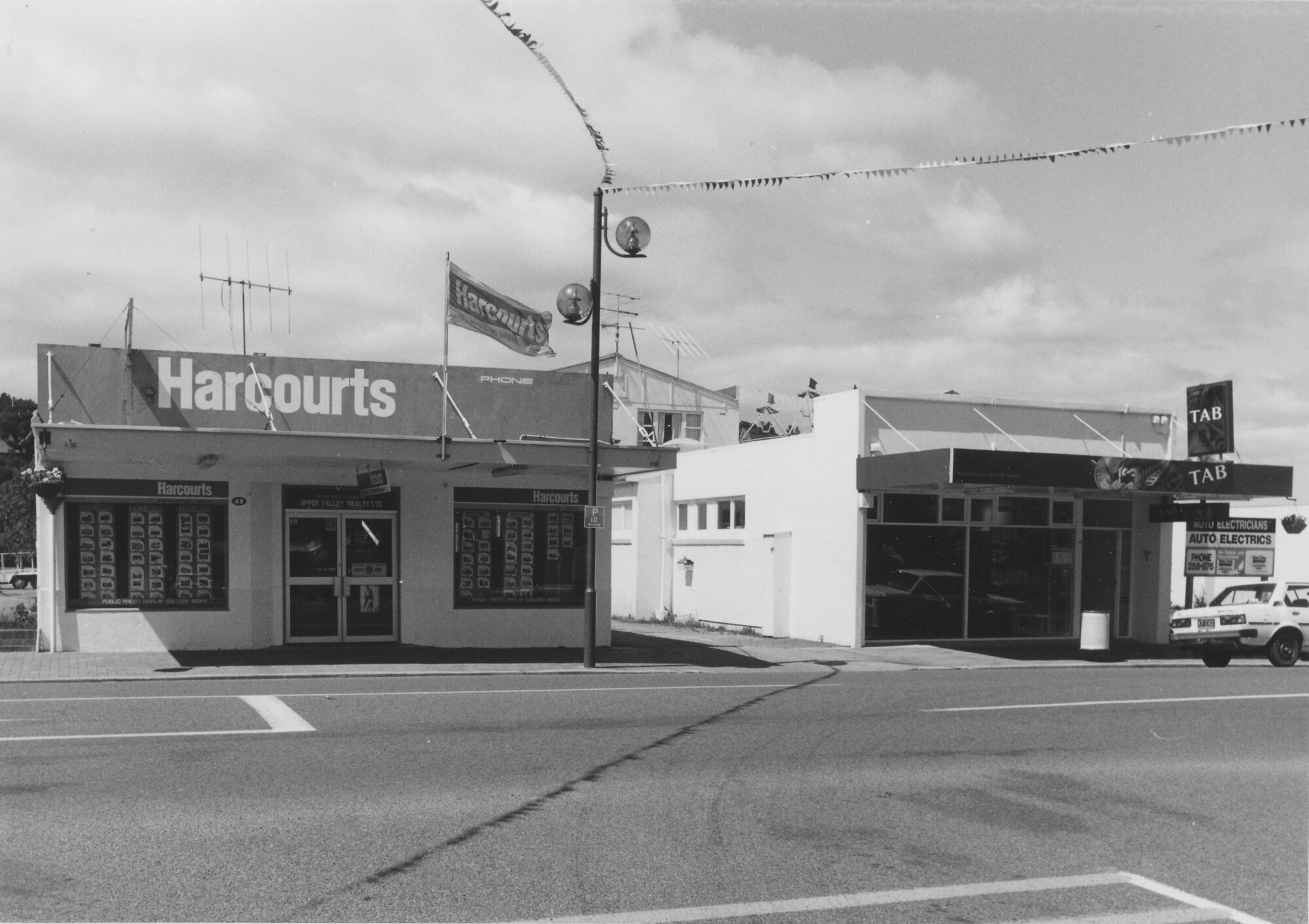 Main Street, 1997, south side; No.  46-48; Harcourts real estate (48), TAB (46).