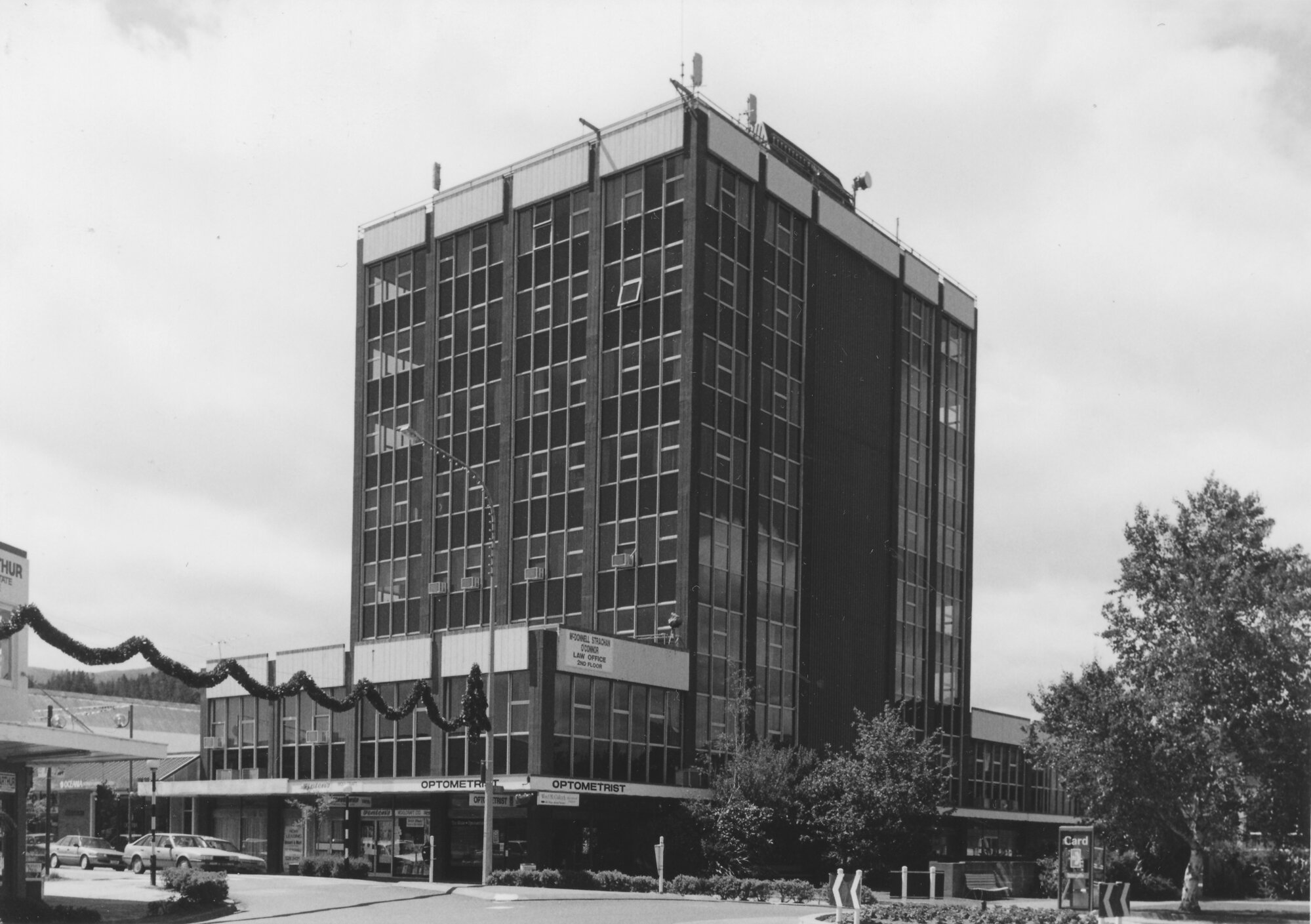 Main Street, 1997, south side; No.  86-90? ; Astral Towers; Tim White, optometrist, visible.