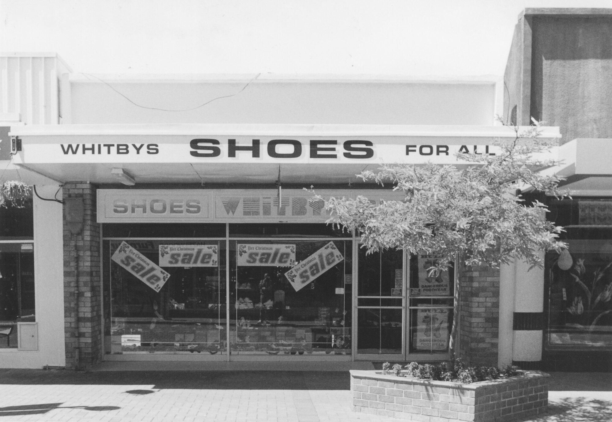Main Street, 1997, south side; No. 132; Whitbys Shoes For All.