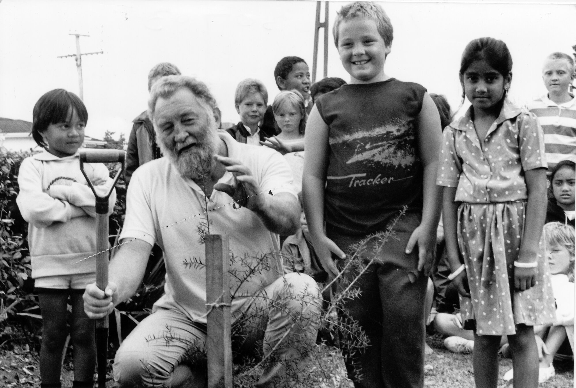 English botanist Dr. David Bellamy plants a tōtara tree at Upper Hutt Primary School; 1989