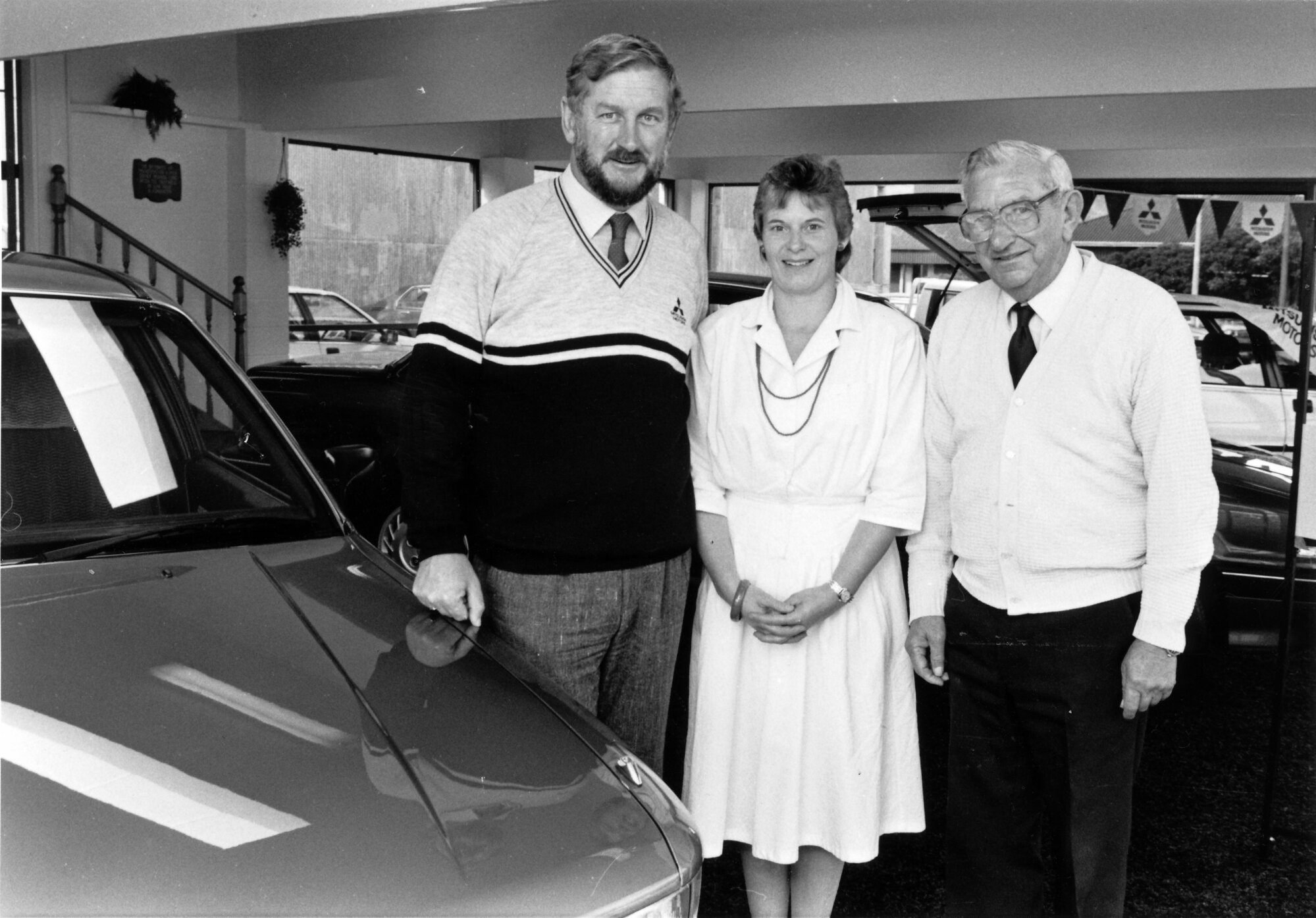 Gethings Motors Ltd; Colin and wife Pamela with Colin's father, Ken; changing agency from Honda to Mitsubishi.