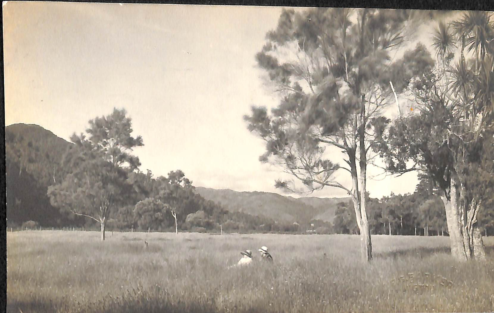 Two women in field; date unknown