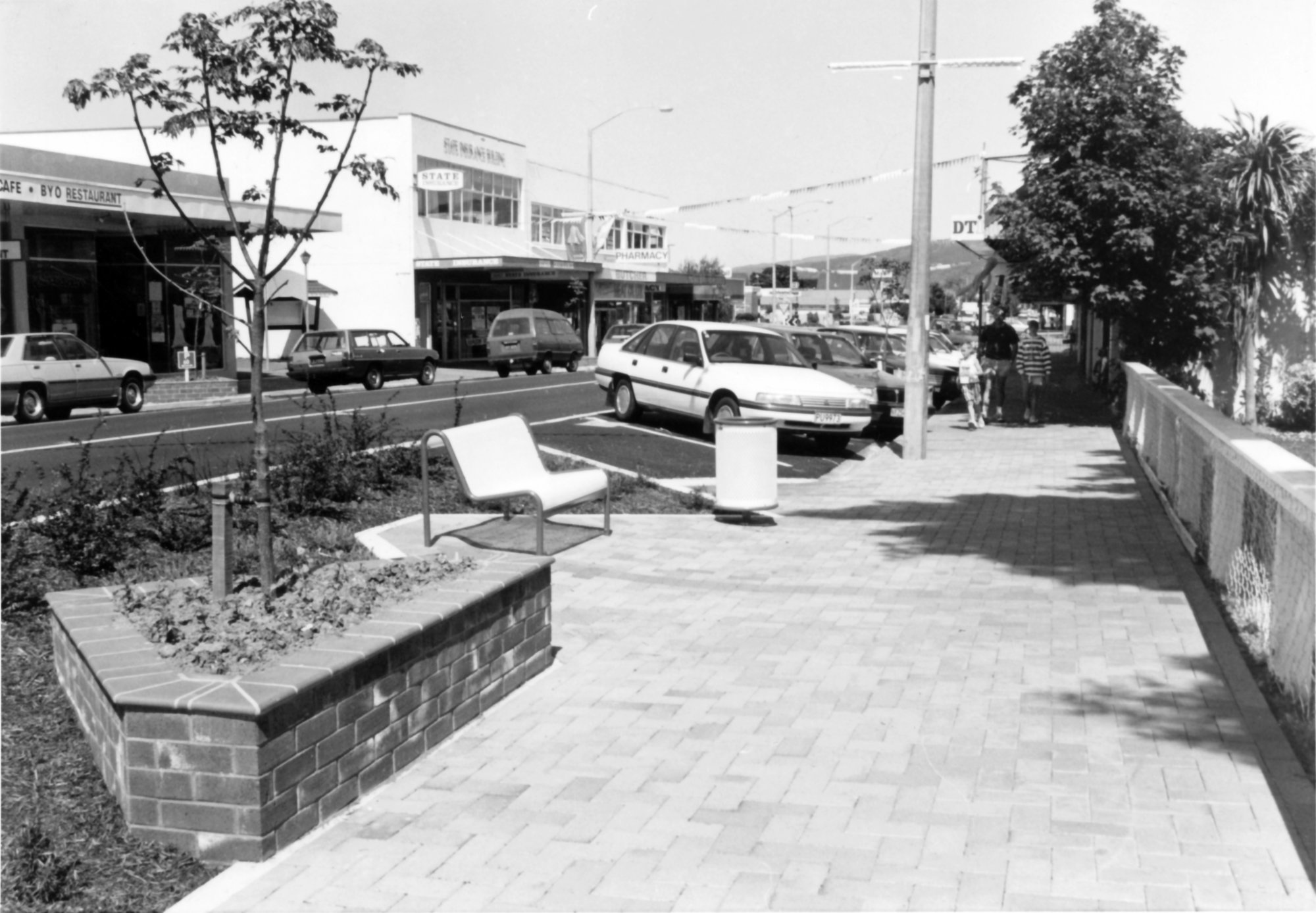 Main Street, west end; new paving and seating, seen from the western corner of Pine Avenue.