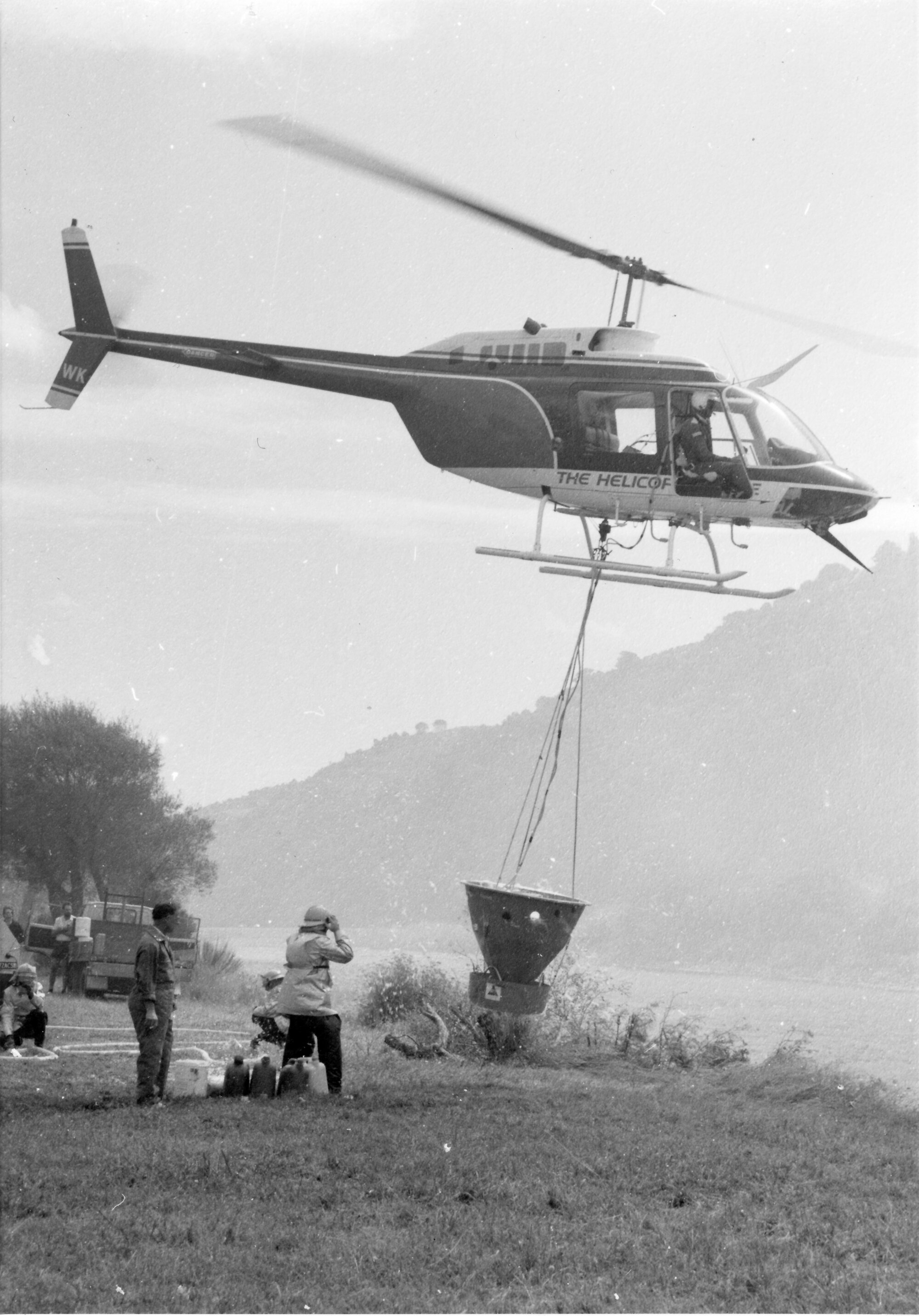 Fire, Moonshine Hill Road; helicopter filling its water bucket, 1988