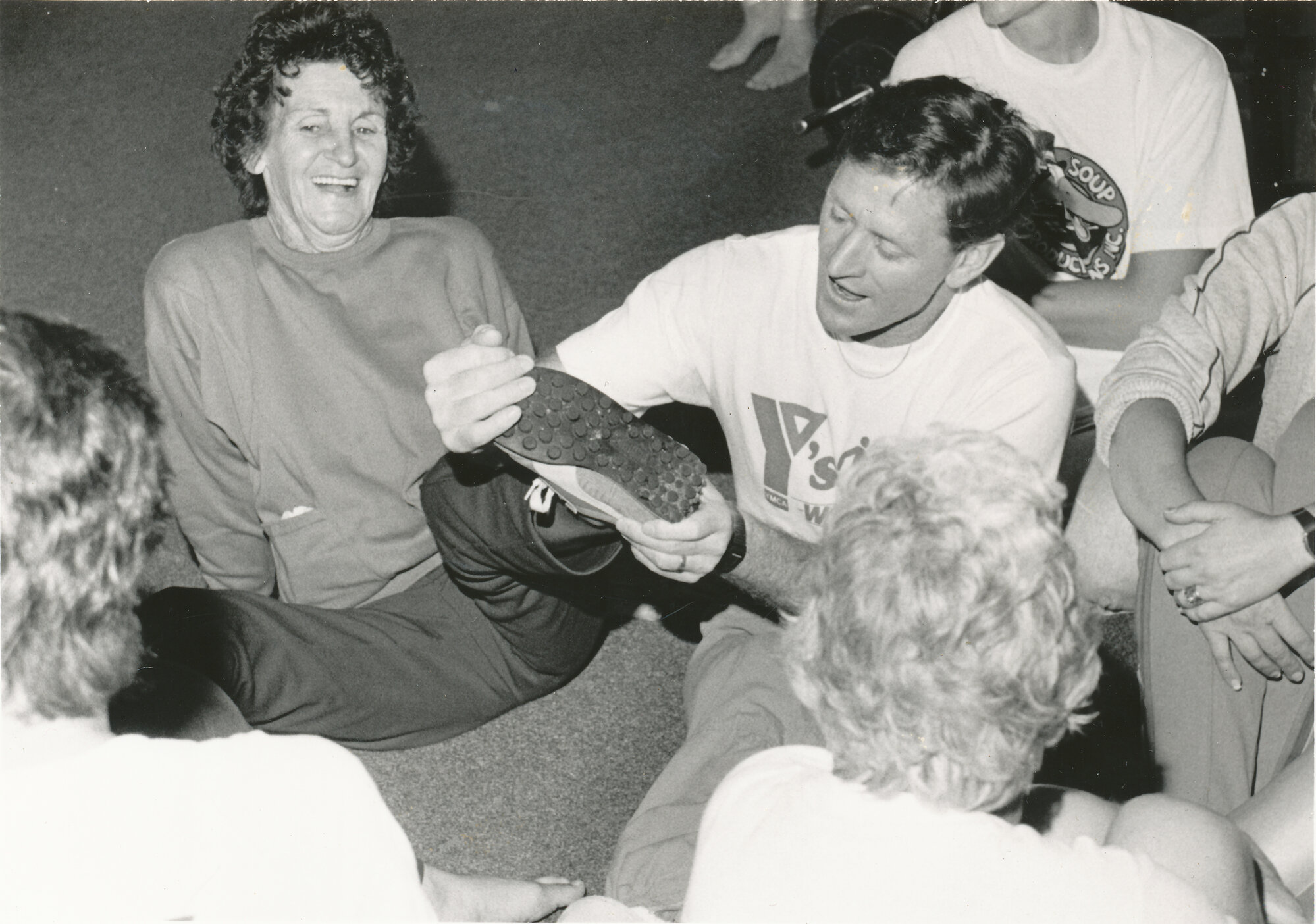 YMCA ''Y's Walking" programme begins; 3-km twilight walks; Edna Whitman's shoe checked by YMCA's Barry Hislop.